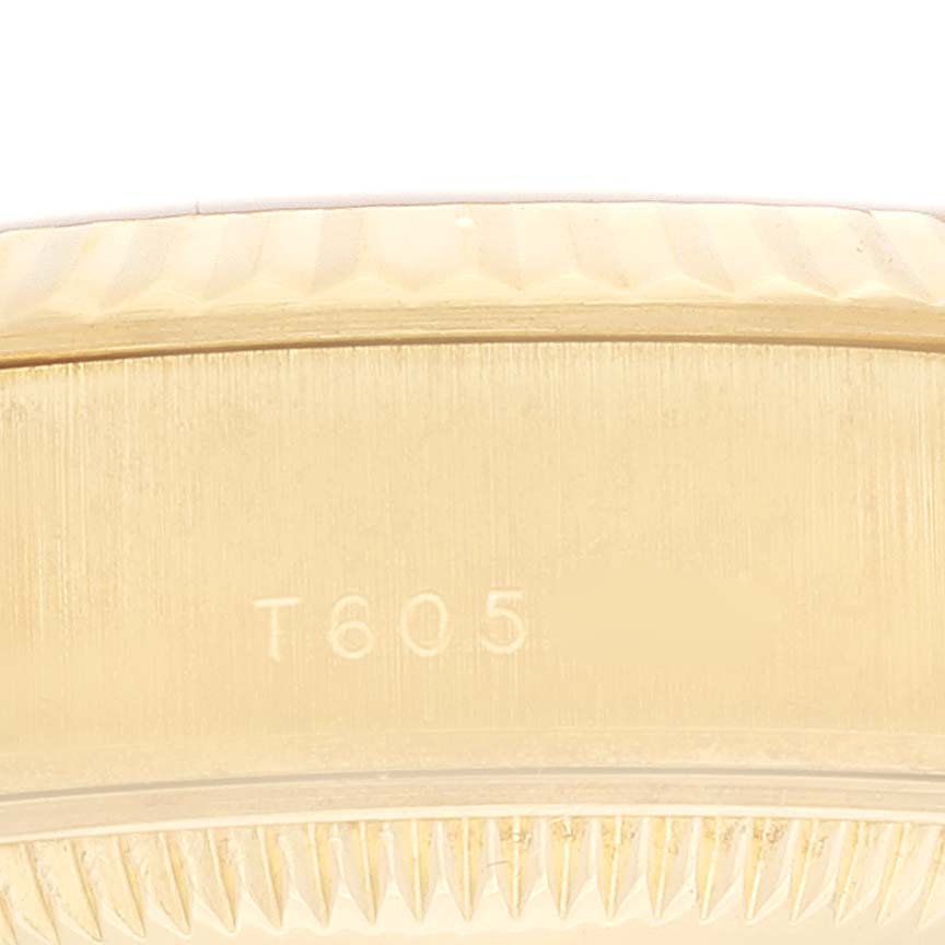 This image shows a close-up angled view of the side of a Rolex President 69178 Women's Yellow Gold Champagne Dial 69178 Women's Yellow Gold Champagne Dial watch, highlighting the bezel and part of the case.