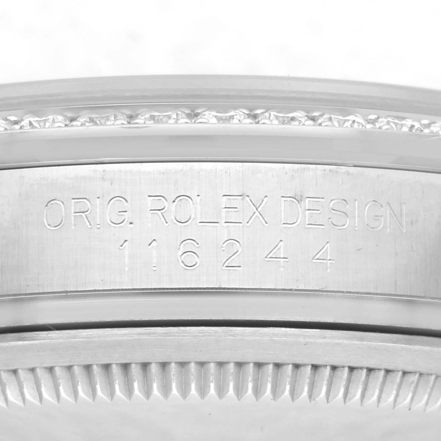 The image shows the side view of a Rolex Datejust 116244 Men's Stainless Steel Silver Dial 116244 Men's Stainless Steel Silver Dial model, focusing on the engraved model number and part of the bezel.