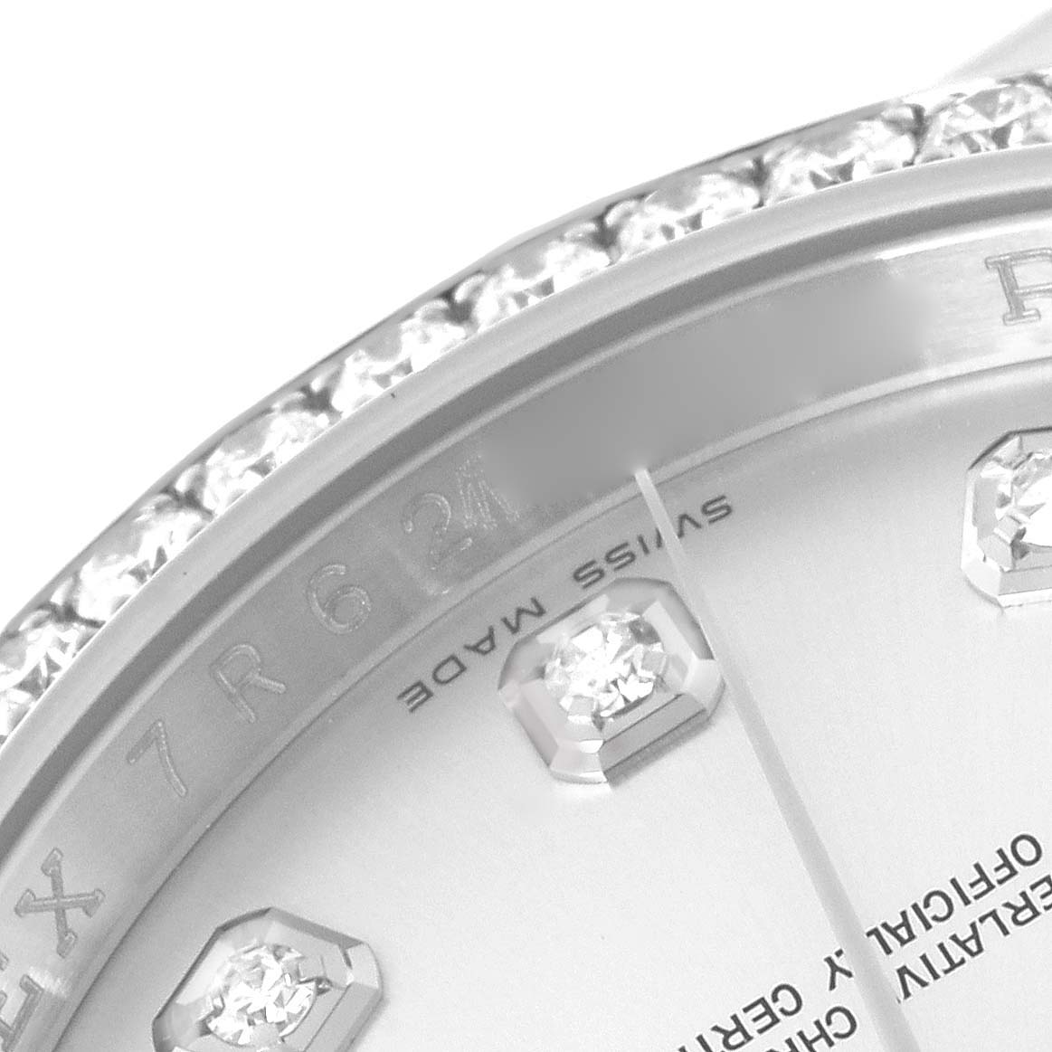 The image shows a close-up of the Rolex Datejust 116244 Men's Stainless Steel Silver Dial 116244 Men's Stainless Steel Silver Dial's diamond-set bezel and dial with part of the hour markers.