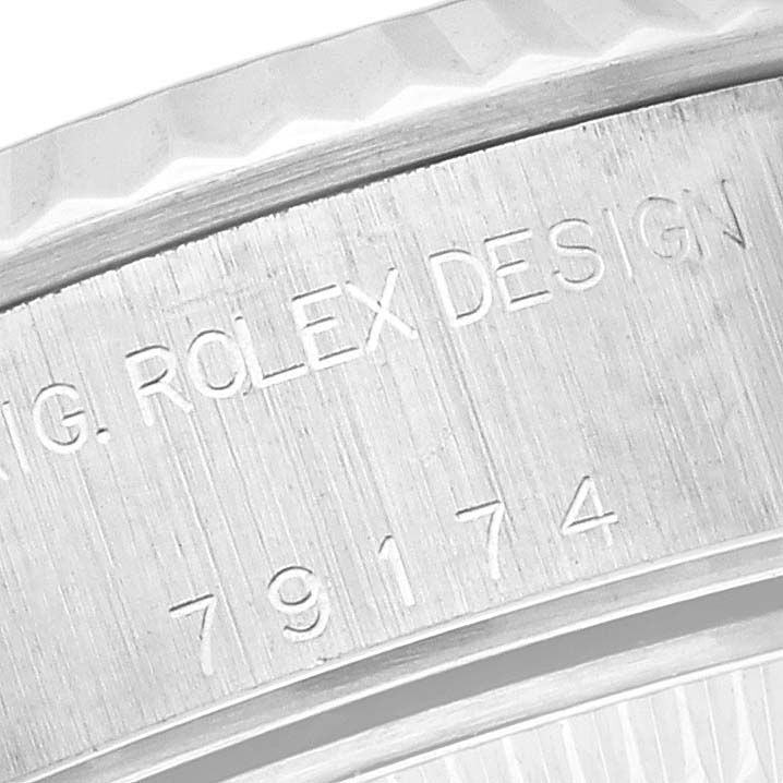 The image shows a close-up of the case side with engraved text on a Rolex Datejust 79174NRD Women's Stainless Steel Mother of Pearl Dial 79174NRD Women's Stainless Steel Mother of Pearl Dial watch.