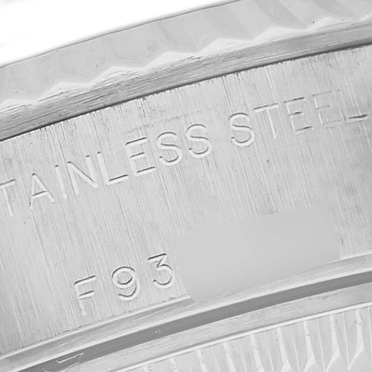 The image shows a close-up of the engraved edge of the Rolex Datejust 79174NRD Women's Stainless Steel Mother of Pearl Dial 79174NRD Women's Stainless Steel Mother of Pearl Dial watch, focusing on its stainless steel inscription.