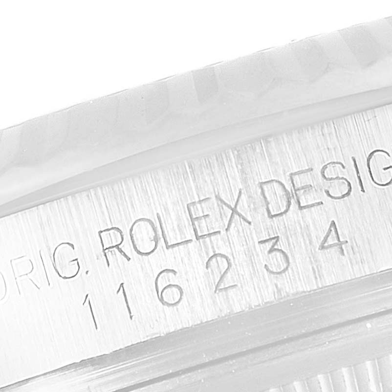 The image shows a close-up of the serial number and engraving on the side of the Rolex Datejust 116234 Men's Stainless Steel Silver Dial 116234 Men's Stainless Steel Silver Dial watch case.