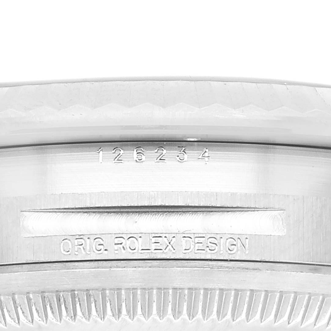 This image shows a close-up of the case back and serial number of a Rolex Datejust 126234 Men's Stainless Steel White Dial 126234 Men's Stainless Steel White Dial watch.
