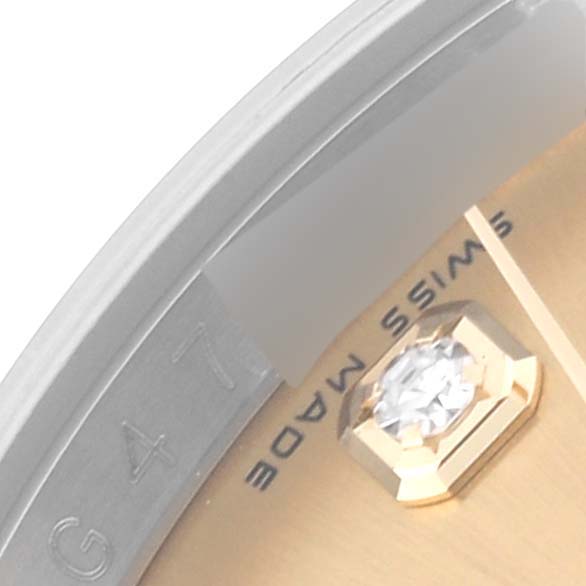 The image shows a close-up of a Rolex Datejust 116233 Men's Steel and Gold (two tone) Champagne Dial 116233 Men's Steel and Gold (two tone) Champagne Dial watch dial with a diamond hour marker, partial bezel, and "Swiss Made" inscription.
