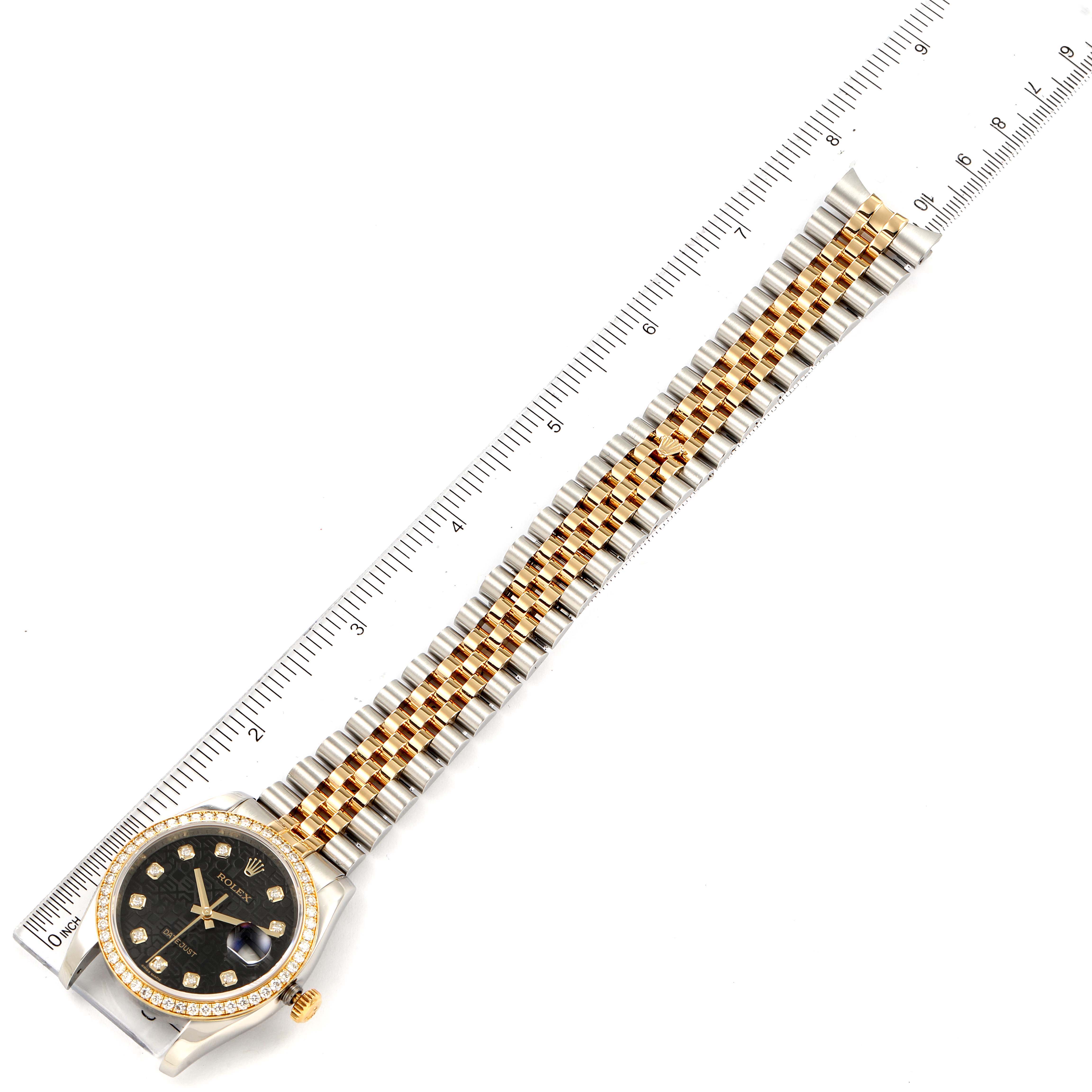 The image shows a Rolex Datejust 116243 Men's Steel and Gold (two tone) Black Dial 116243 Men's Steel and Gold (two tone) Black Dial watch laid flat with a ruler measuring the length, highlighting the dial, bezel, and bracelet.