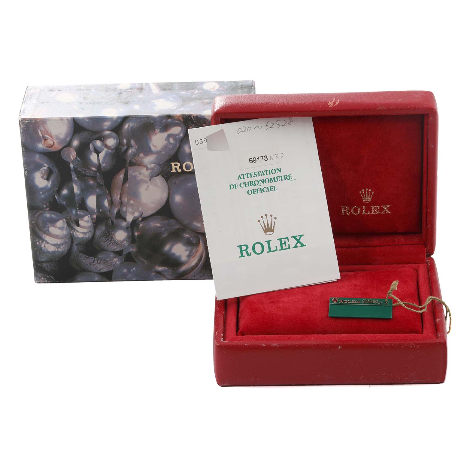 The image displays a Rolex Datejust 69173 Women's Steel and Gold (two tone) Mother of Pearl Dial 69173 Women's Steel and Gold (two tone) Mother of Pearl Dial watch box, a certificate, and a hang tag from a top-down angle.
