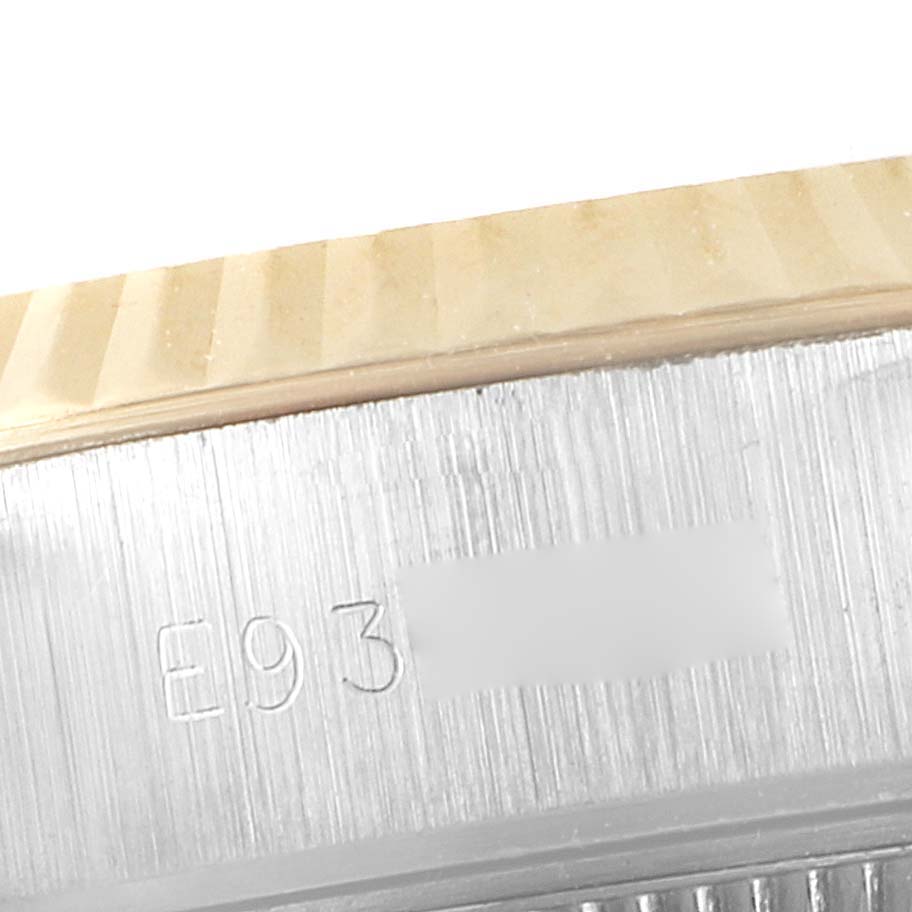 This close-up image shows a side view of the bezel and case of a Rolex Datejust 69173 Women's Steel and Gold (two tone) White Dial 69173 Women's Steel and Gold (two tone) White Dial watch, with part of the serial number visible.