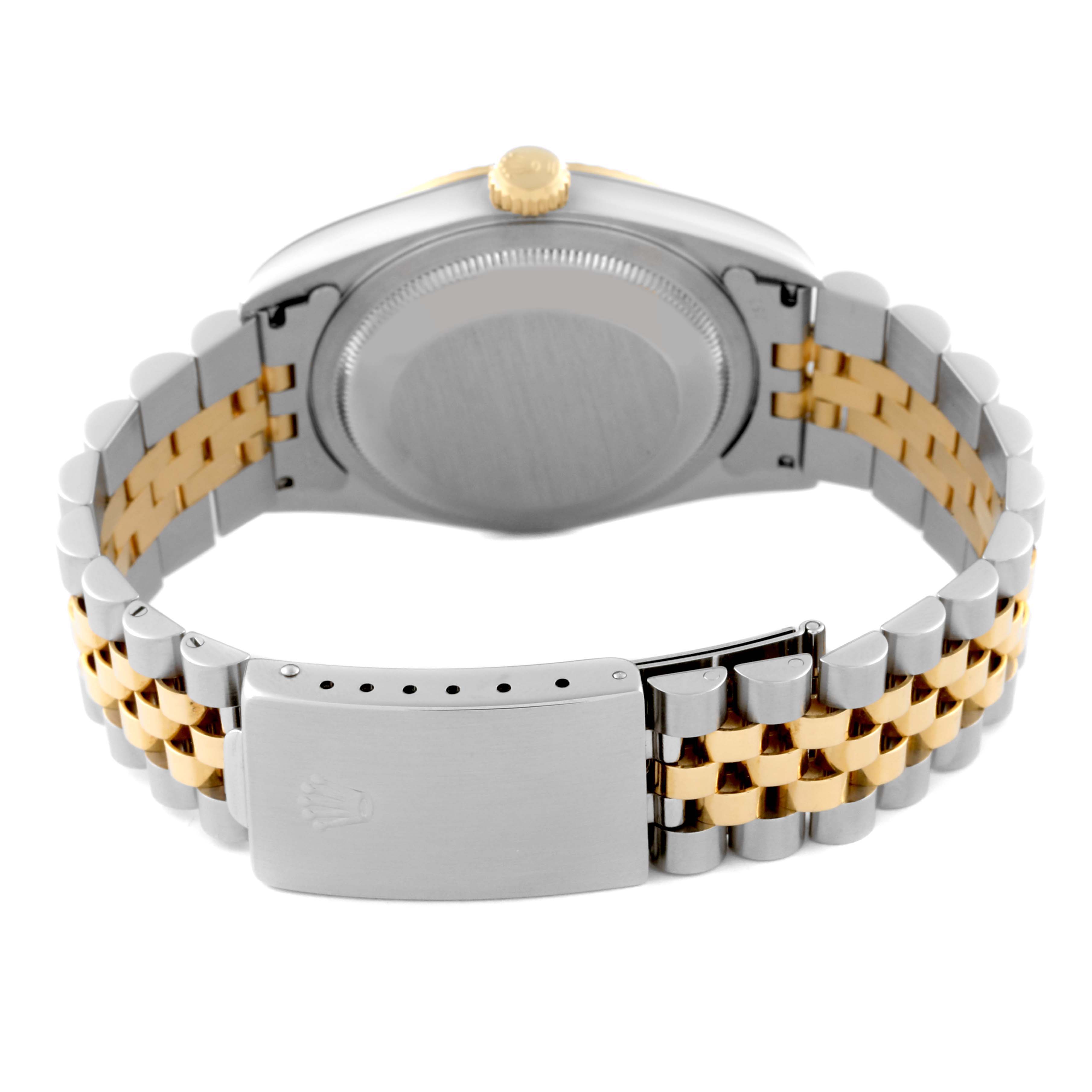 The Rolex Datejust 16233 Men's Steel and Gold (two tone) White Dial 16233 Men's Steel and Gold (two tone) White Dial watch is shown from the back, highlighting its case, crown, and two-tone bracelet clasp.
