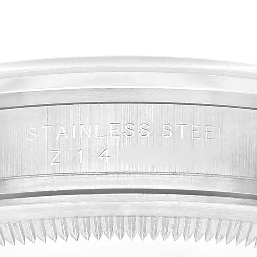 The image shows an enlarged view of the side of a stainless steel bezel on a Rolex Explorer 114270 Men
s Stainless Steel Black Dial 114270 Men
s Stainless Steel Black Dial model watch.