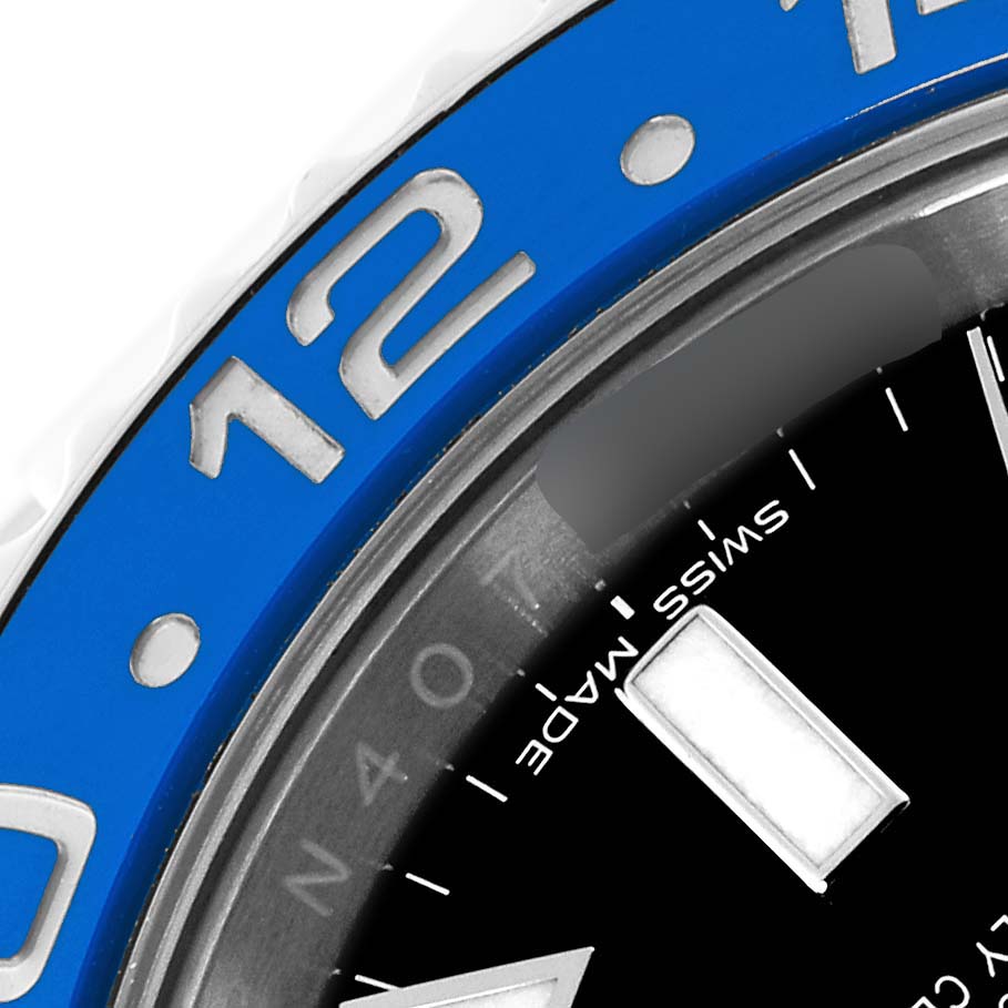 The image shows a close-up of the blue bezel and part of the black dial of a Rolex GMT-Master 116710BLNR Men
s Stainless Steel Black Dial 116710BLNR Men
s Stainless Steel Black Dial watch.