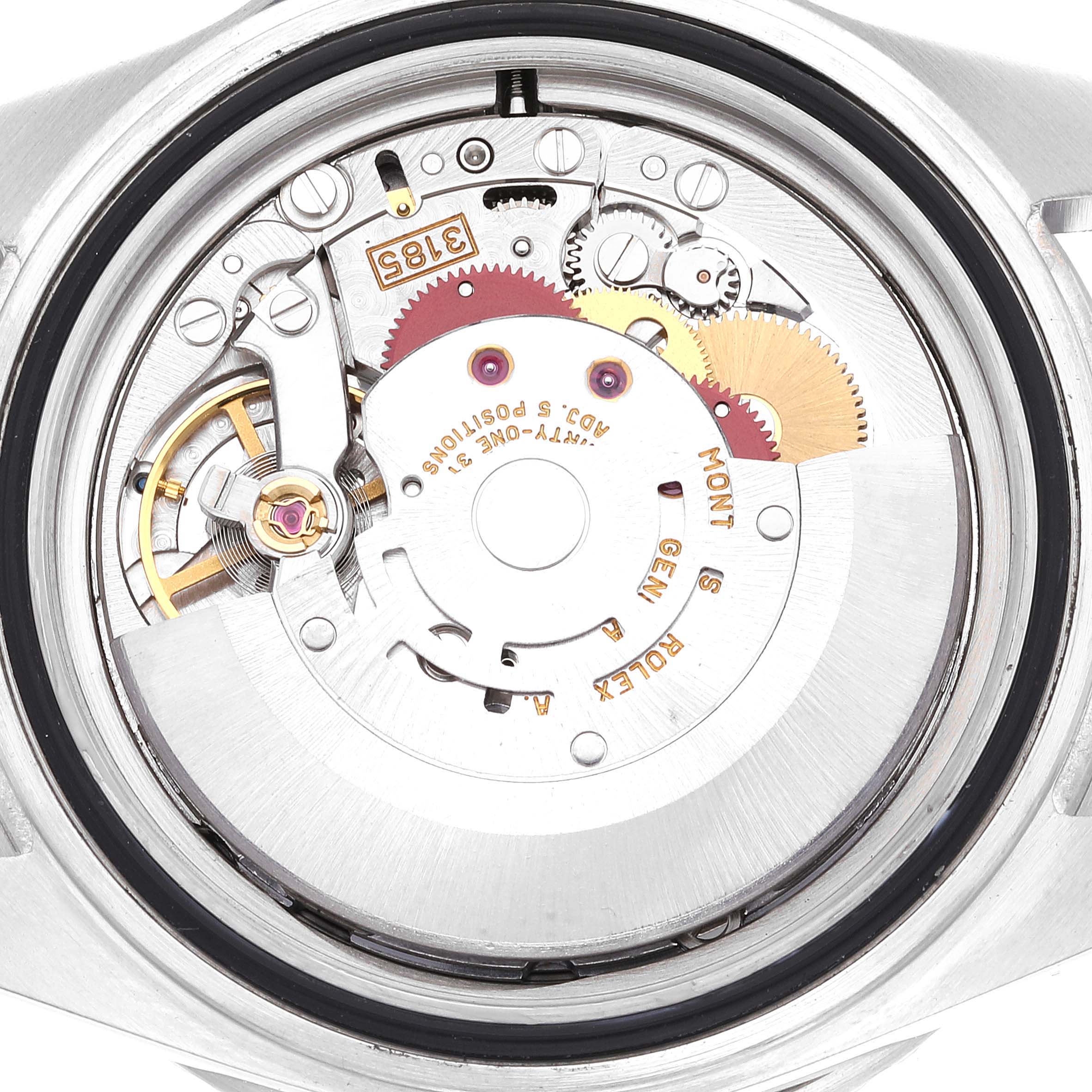 The image shows the internal mechanism of a Rolex GMT-Master 16710 Men
s Stainless Steel Black Dial 16710 Men
s Stainless Steel Black Dial watch from the back, highlighting the movement parts and gears.