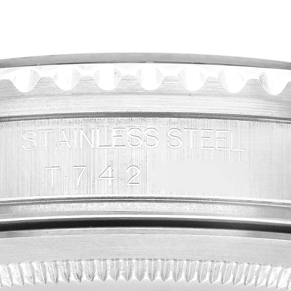 This image shows a close-up of the side of a Rolex GMT-Master 16710 Men
s Stainless Steel Black Dial 16710 Men
s Stainless Steel Black Dial watch, focusing on its stainless steel casing and markings.