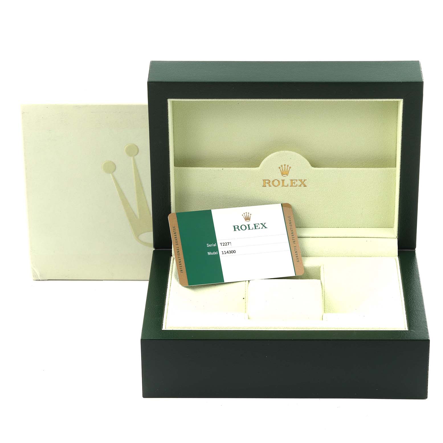 The image shows an empty Rolex Oyster Perpetual 114300 Men's Stainless Steel Blue Dial 114300 Men's Stainless Steel Blue Dial box with a warranty card placed inside.