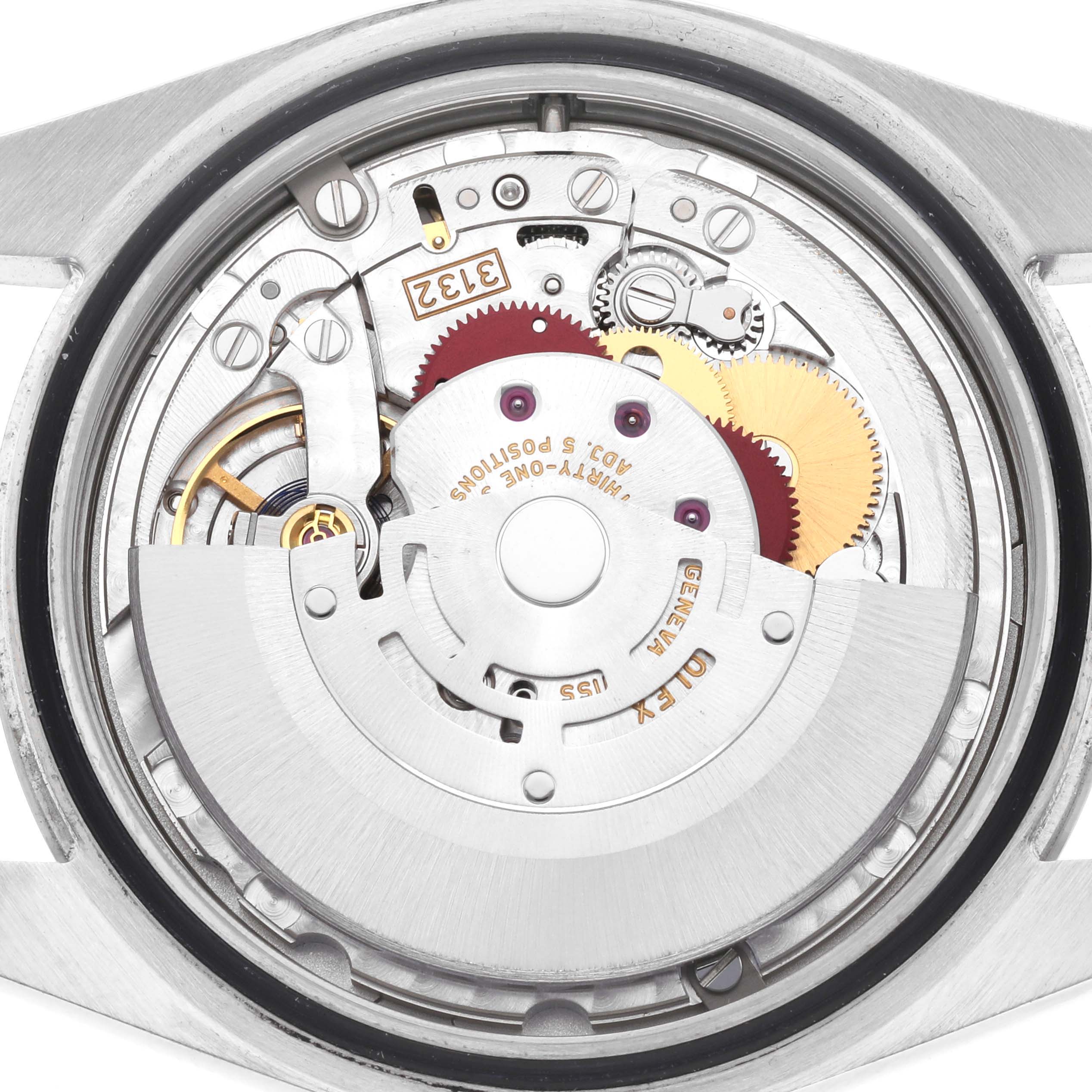 The image shows the movement mechanism of a Rolex Oyster Perpetual 114300 Men's Stainless Steel Red Dial 114300 Men's Stainless Steel Red Dial watch from the back.
