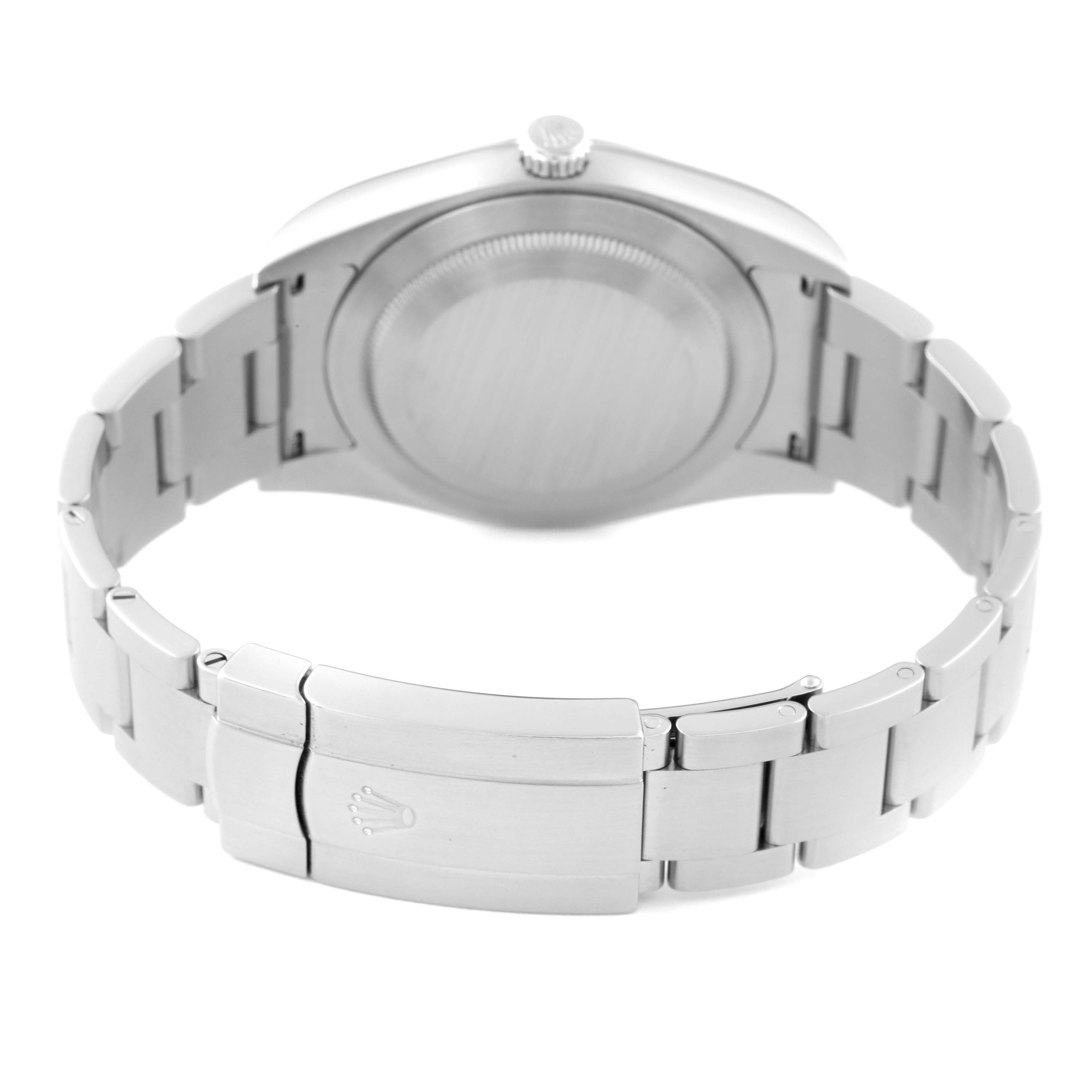 The image shows the back view of a Rolex Oyster Perpetual 114300 Men's Stainless Steel Red Dial 114300 Men's Stainless Steel Red Dial, highlighting its case back and bracelet clasp.