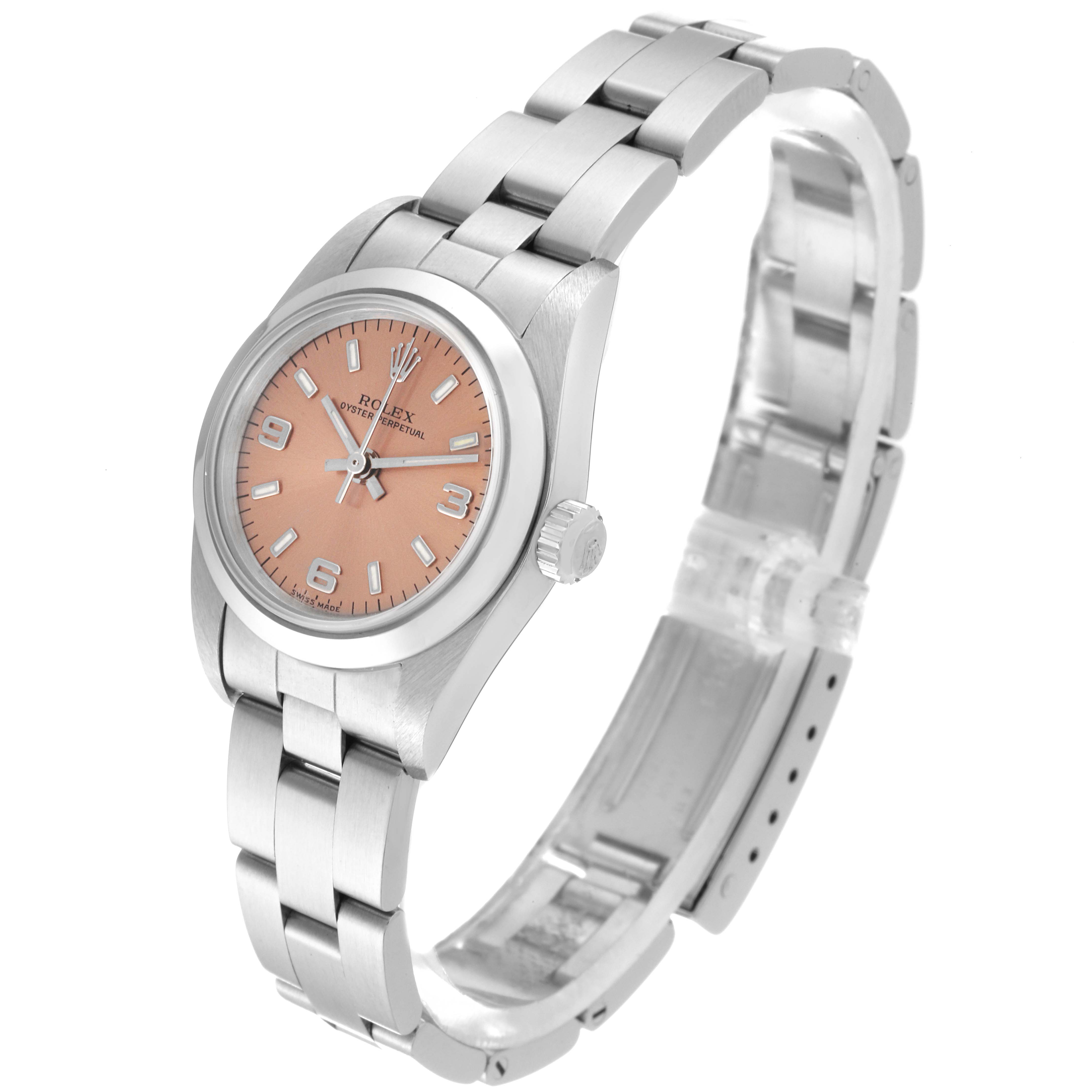 The Rolex Oyster Perpetual 76080 Women's Stainless Steel Pink Dial 76080 Women's Stainless Steel Pink Dial watch is shown at an angled view, displaying the face, bezel, crown, and bracelet.