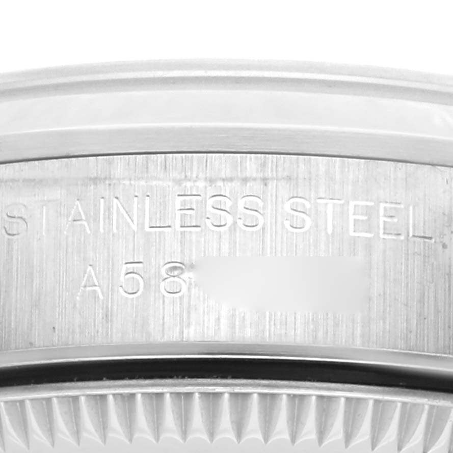 This image shows a close-up of the side engraving on an Oyster Perpetual Rolex watch, highlighting "STAINLESS STEEL A58."