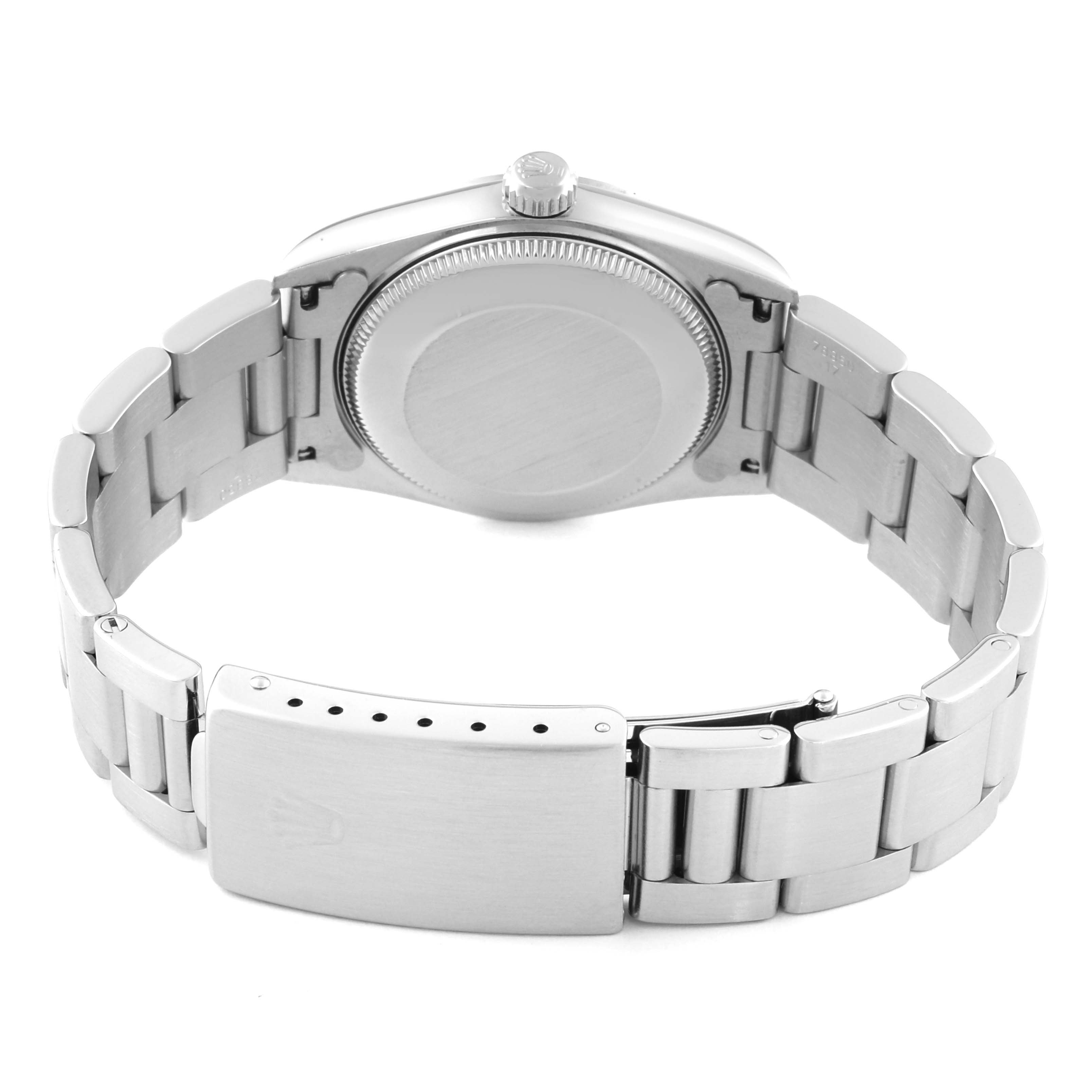 The image shows the back and bracelet of a Rolex Oyster Perpetual watch, highlighting the case back and clasp.