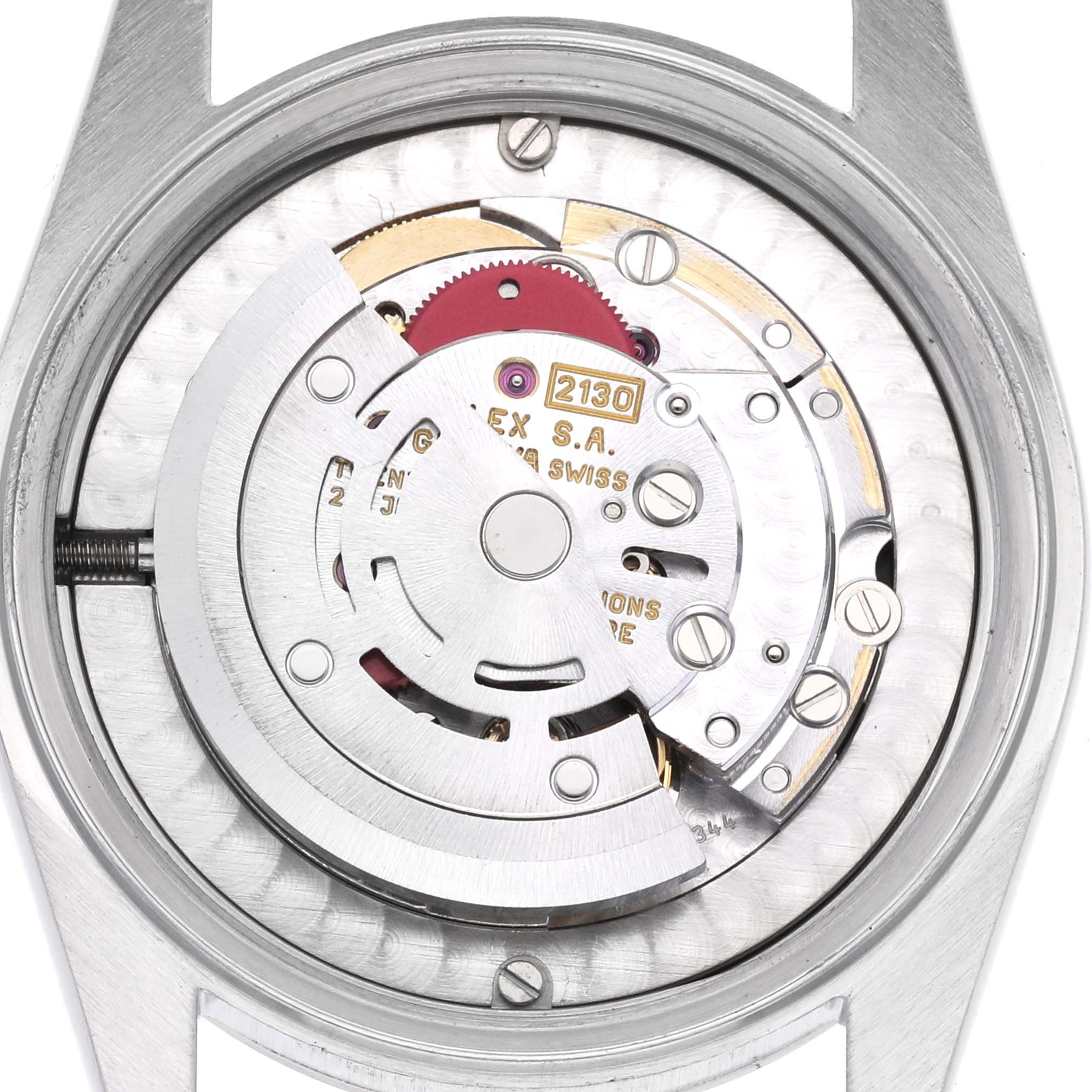 The image shows the back view of the Rolex Oyster Perpetual, displaying its internal movement components.