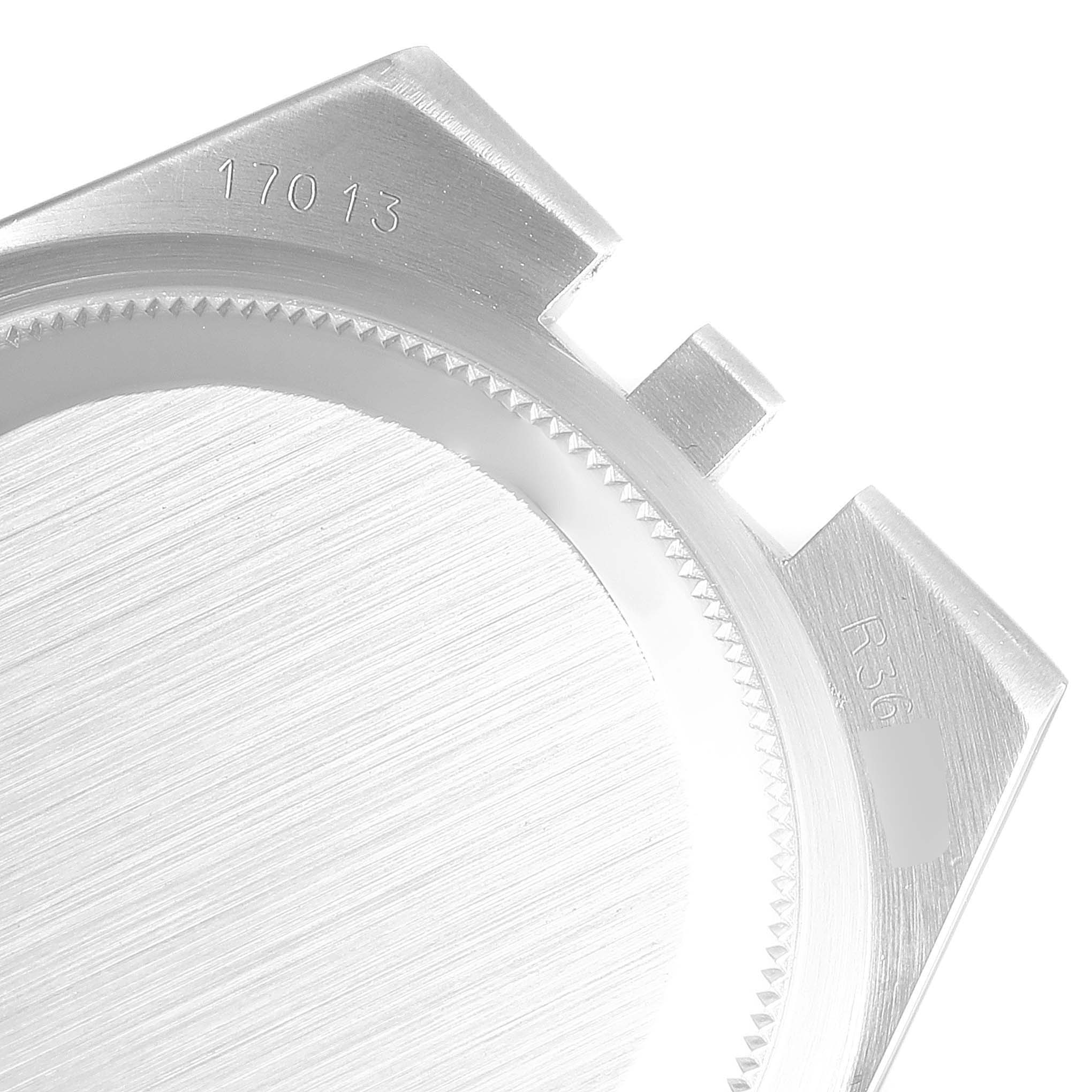 This image shows a close-up angle of the case back of a Rolex Oysterquartz 17013 Men's Steel and Gold (two tone) Champagne Dial 17013 Men's Steel and Gold (two tone) Champagne Dial model, highlighting the model number and part engravings.