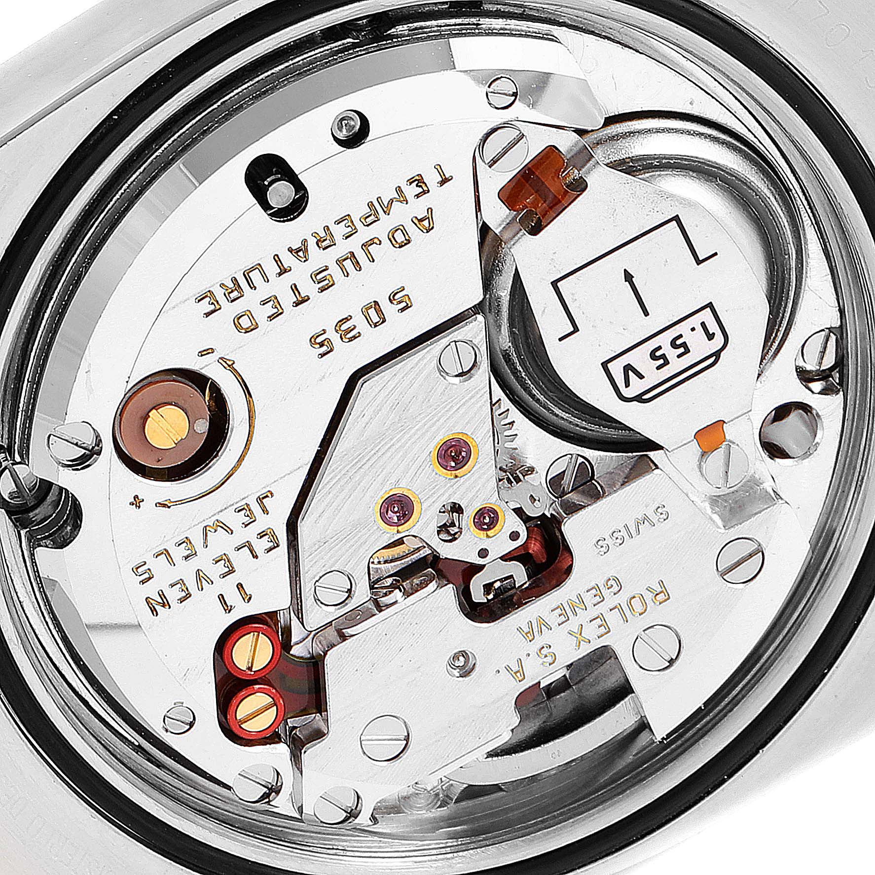 The image shows a close-up view of the movement of a Rolex Oysterquartz 17013 Men's Steel and Gold (two tone) Champagne Dial 17013 Men's Steel and Gold (two tone) Champagne Dial watch, highlighting its intricate internal mechanisms.