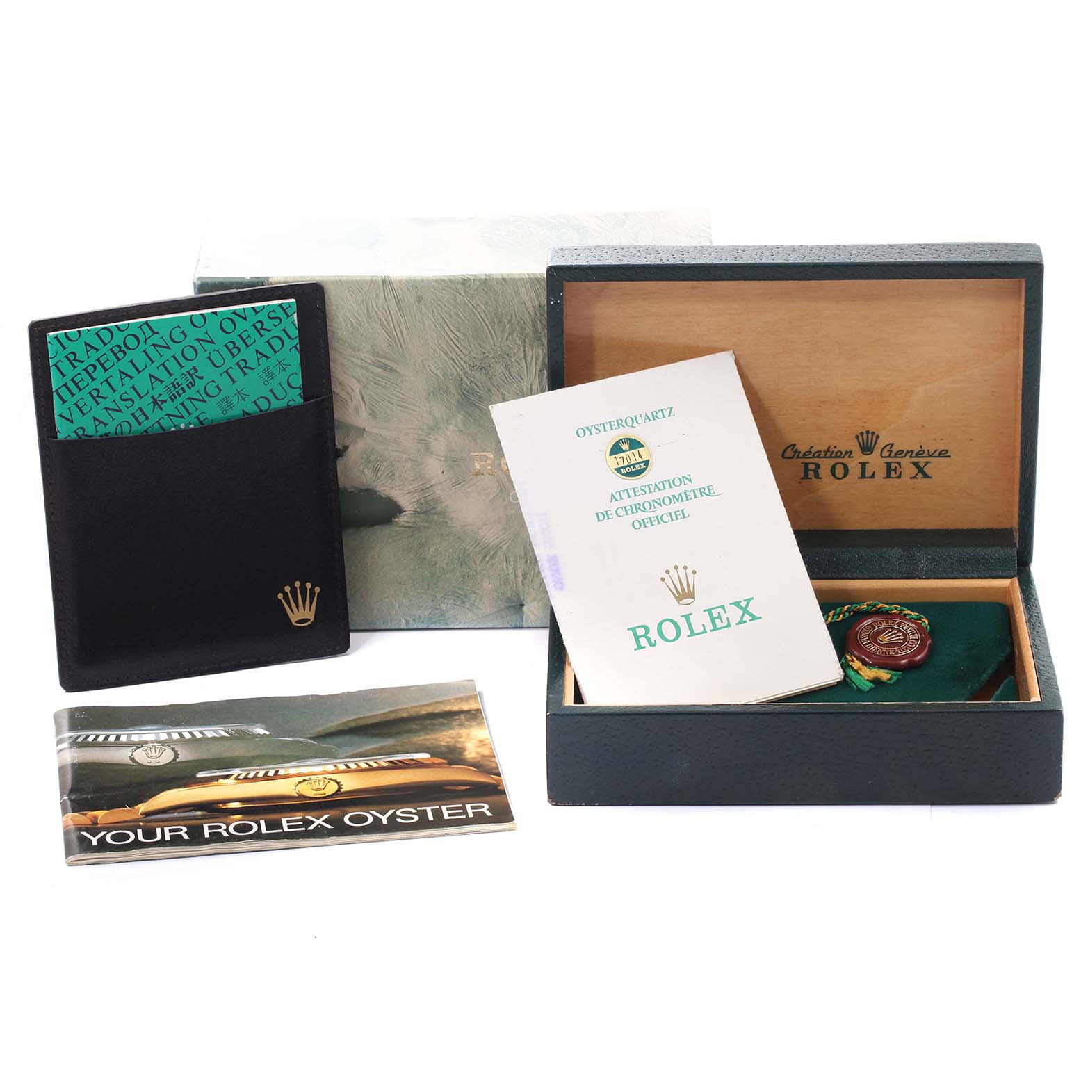 The image displays various accessories for a Rolex Oysterquartz 17014 Men
s Stainless Steel White Dial 17014 Men
s Stainless Steel White Dial model, including manuals, a box, and documentation.