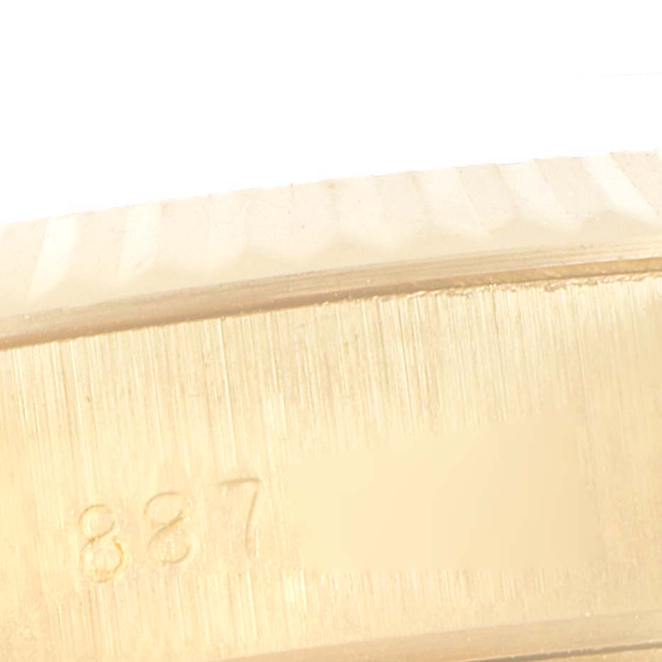The image shows a close-up of the case edge with serial numbers on a Rolex President 69178 Women's Yellow Gold Champagne Dial 69178 Women's Yellow Gold Champagne Dial model watch.