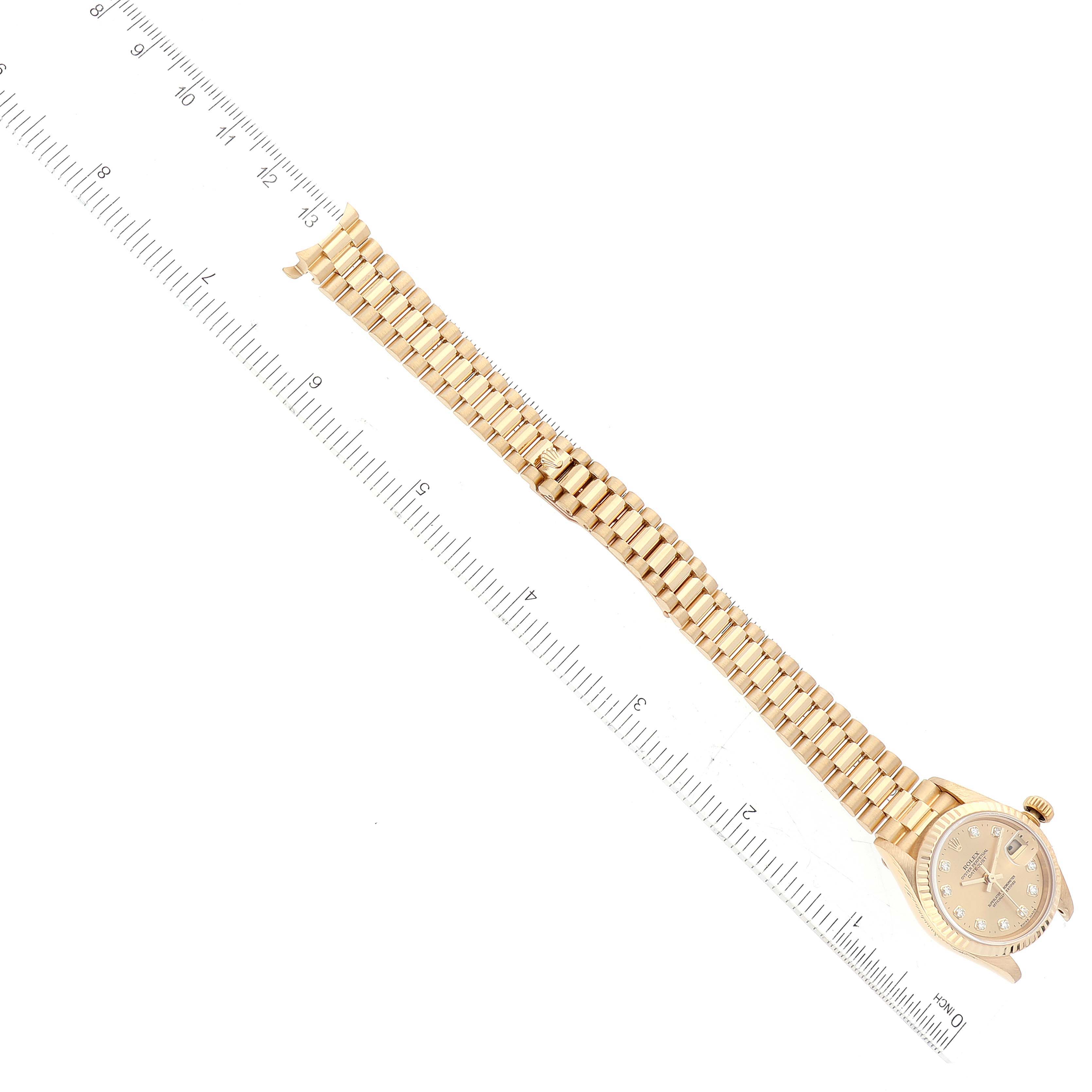 The Rolex President 79178 Women's Yellow Gold Champagne Dial 79178 Women's Yellow Gold Champagne Dial model watch is shown laid flat with the face and the full length of the band visible.