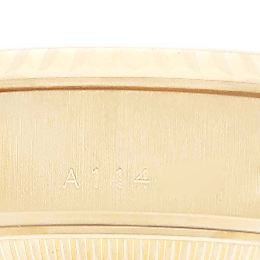 This image shows a close-up view of the inner case back of a Rolex President 79178 Women's Yellow Gold Champagne Dial 79178 Women's Yellow Gold Champagne Dial model watch, including part of its engravings.