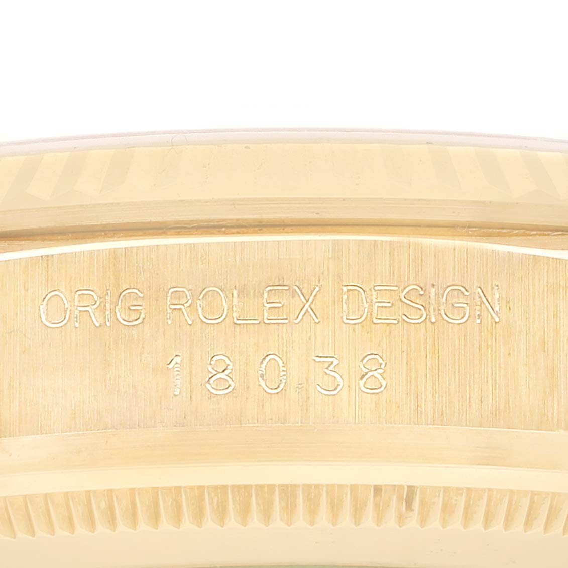 The image shows the serial numbers and engraving on the inner bezel of a Rolex President 18038 Men
s Yellow Gold Champagne Dial 18038 Men
s Yellow Gold Champagne Dial model watch.