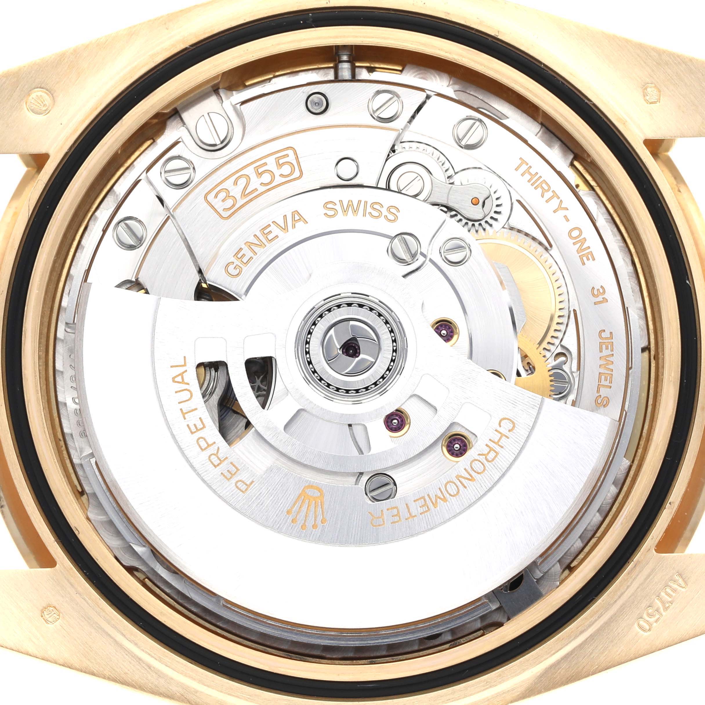 The image shows the movement of a Rolex President M228398TBR-0036 Men's Yellow Gold Champagne Dial M228398TBR-0036 Men's Yellow Gold Champagne Dial model watch from a rear angle, highlighting its intricate mechanical parts.