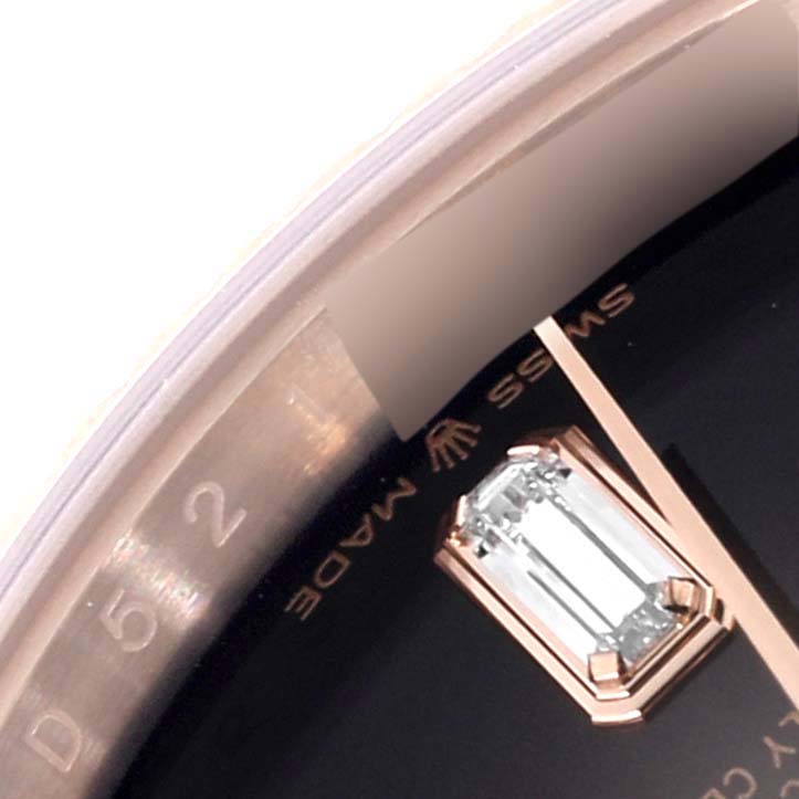 This Rolex President 128235 Men
s Rose Gold Brown Dial 128235 Men
s Rose Gold Brown Dial watch image shows a close-up of the dial with a diamond hour marker, partial bezel, and "Swiss Made" text.