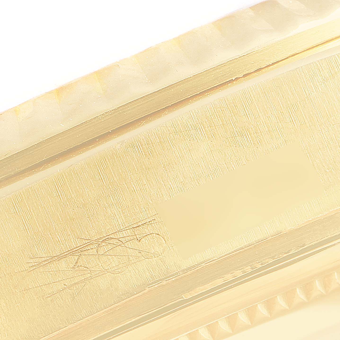 The image shows a close-up of the side of the Rolex President 1803 Men
s Yellow Gold Silver Dial 1803 Men
s Yellow Gold Silver Dial model watch, highlighting its gold finish and detailing.