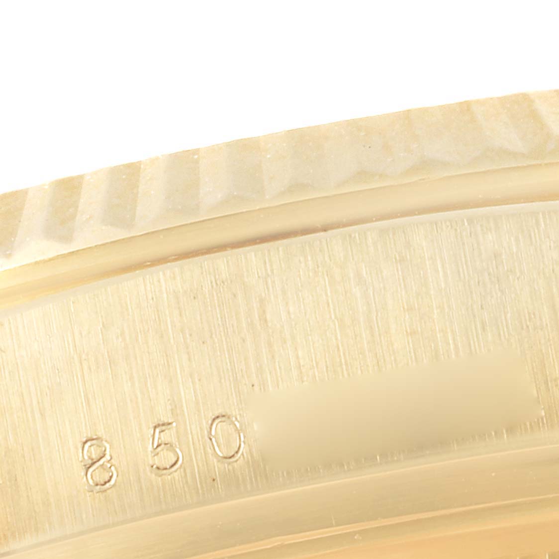 The image shows a close-up of the bezel edge and part of the case back with engraving on a Rolex President 18038 Men
s Yellow Gold Champagne Dial 18038 Men
s Yellow Gold Champagne Dial model watch.