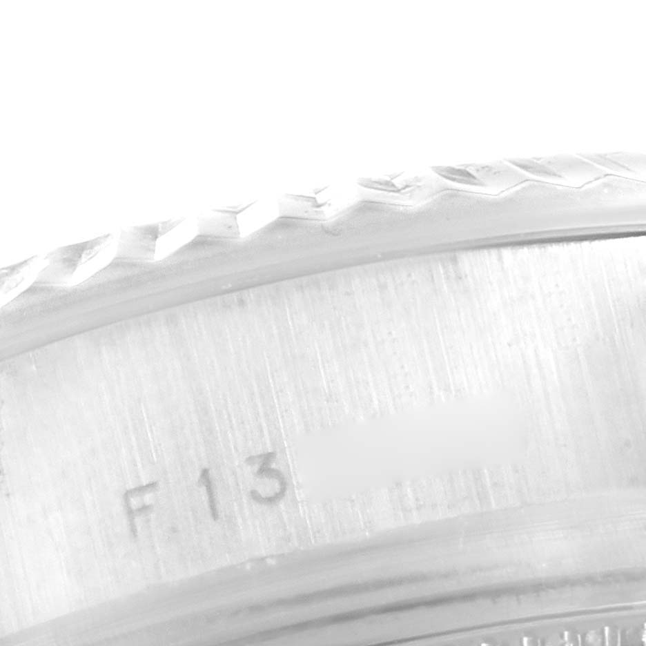 This image shows a close-up of the bezel and engraved serial number on the edge of a Rolex President 179179 Women's White Gold Silver Dial 179179 Women's White Gold Silver Dial model watch.