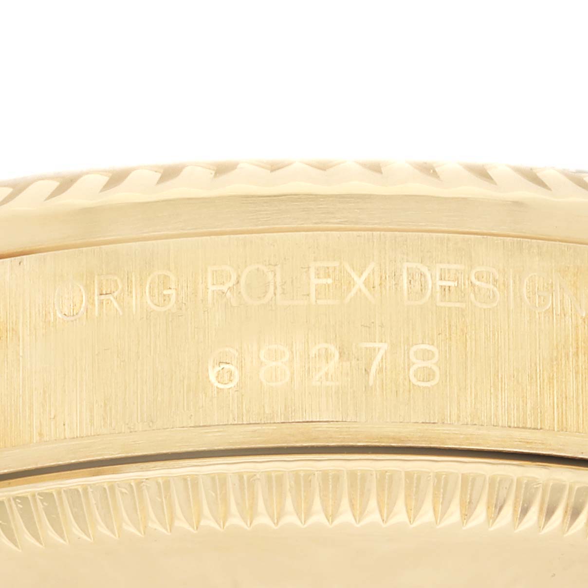 The image shows a close-up of the side of a Rolex President 68278 Women's Yellow Gold Champagne Dial 68278 Women's Yellow Gold Champagne Dial model, revealing the engraved model number.