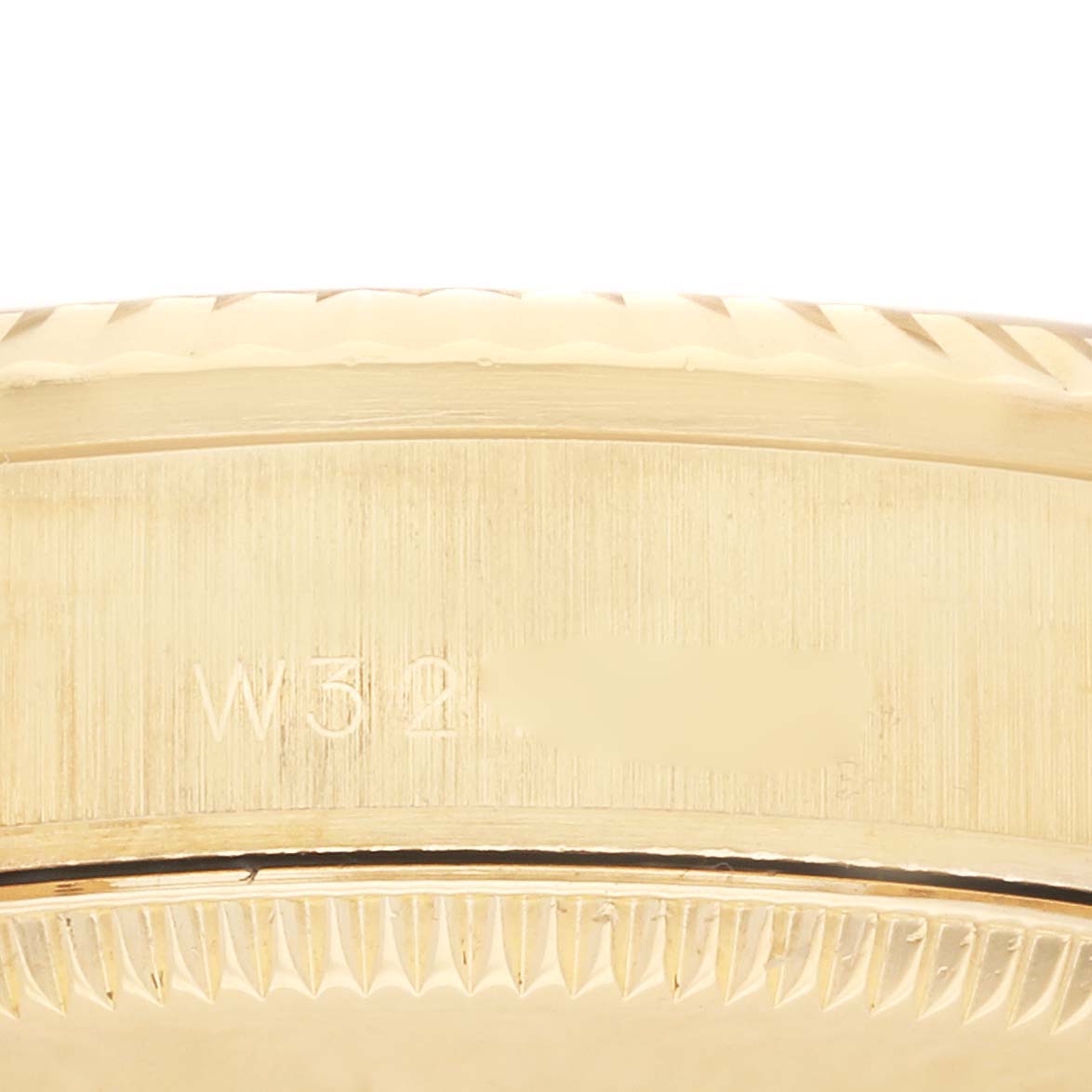 The image shows a side view of the engraved case of the Rolex President 68278 Women's Yellow Gold Champagne Dial 68278 Women's Yellow Gold Champagne Dial model, focusing on the model's edge details.