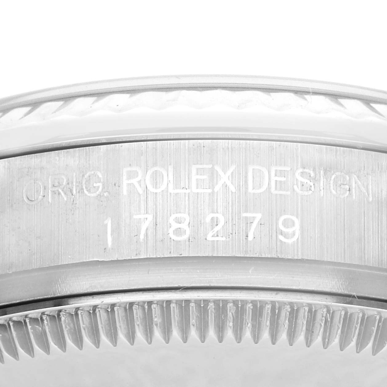 The image shows the side of a Rolex President 178279 Women's White Gold White Dial 178279 Women's White Gold White Dial model, focusing on the engraved bezel and design details.
