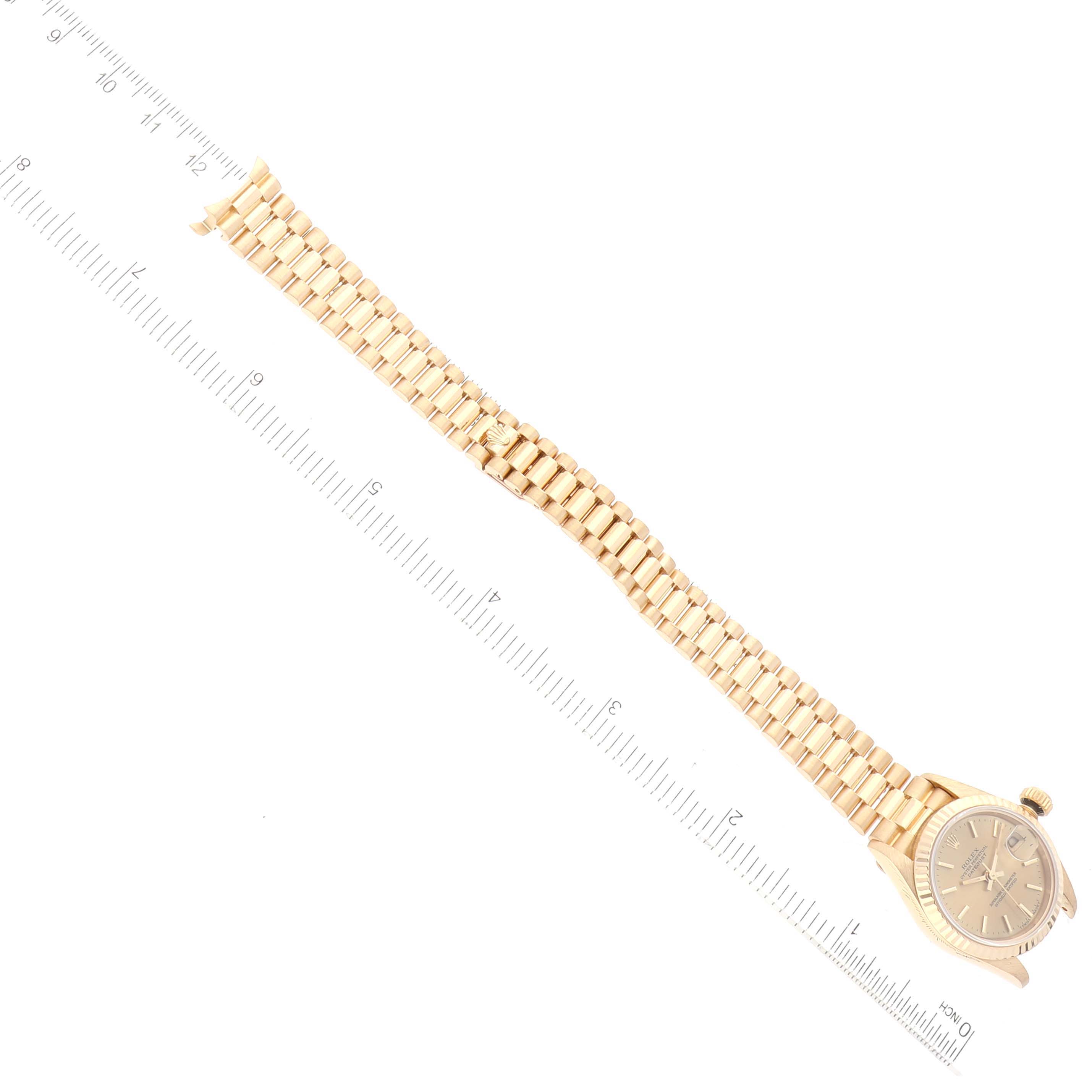 The image shows a Rolex President 69178 Women
s Yellow Gold Champagne Dial 69178 Women
s Yellow Gold Champagne Dial model watch laid flat with its face and entire bracelet visible.