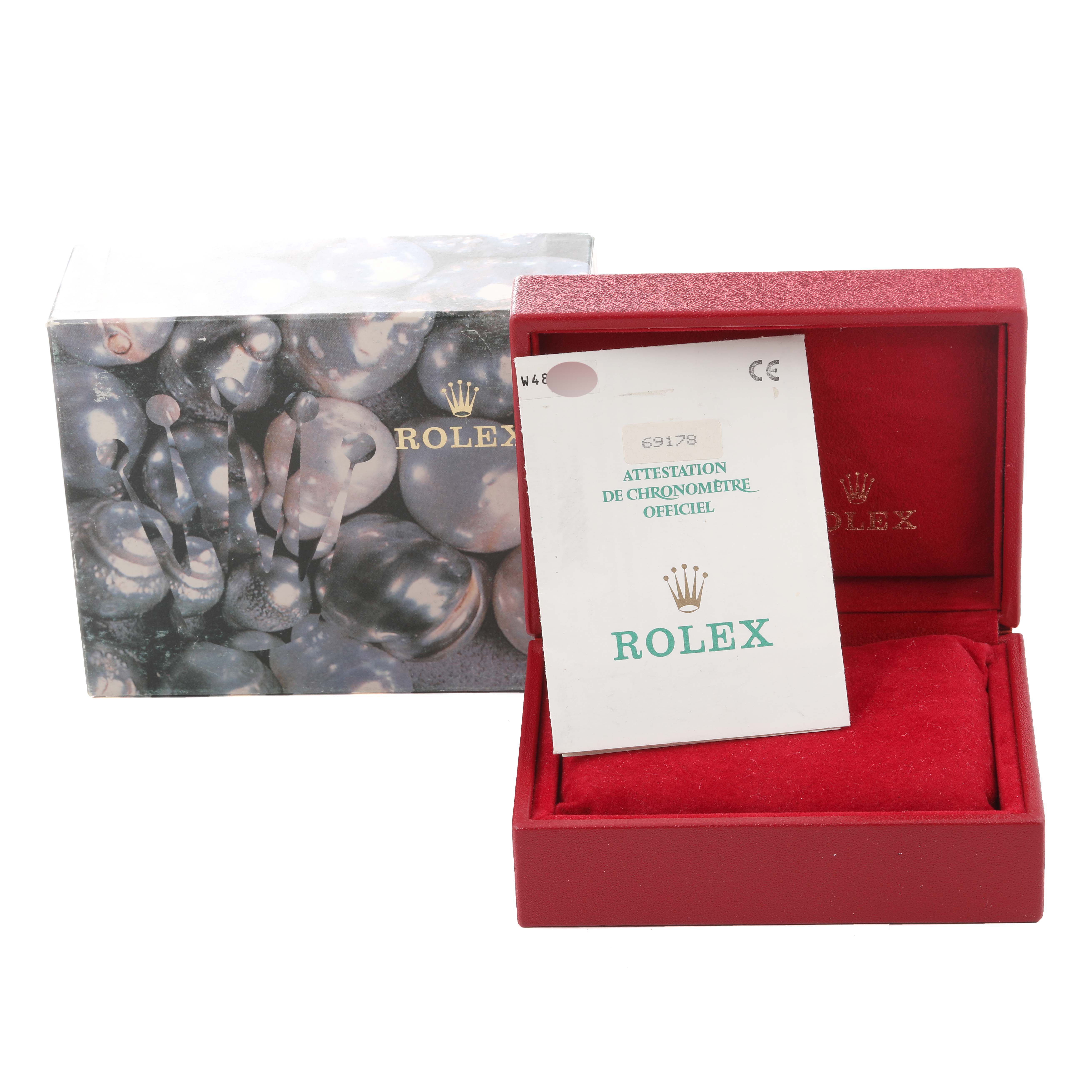 The image shows a Rolex President 69178 Women
s Yellow Gold Champagne Dial 69178 Women
s Yellow Gold Champagne Dial model box with certification papers, angled to display both the box and the pamphlet.