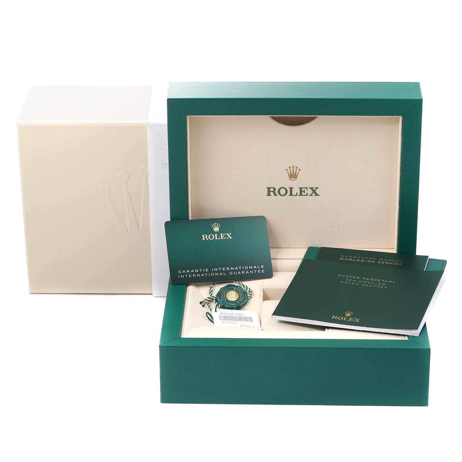 The image shows the packaging, warranty card, and manuals for a Rolex Sea-Dweller 126660 Men
s Stainless Steel Blue Dial 126660 Men
s Stainless Steel Blue Dial watch.