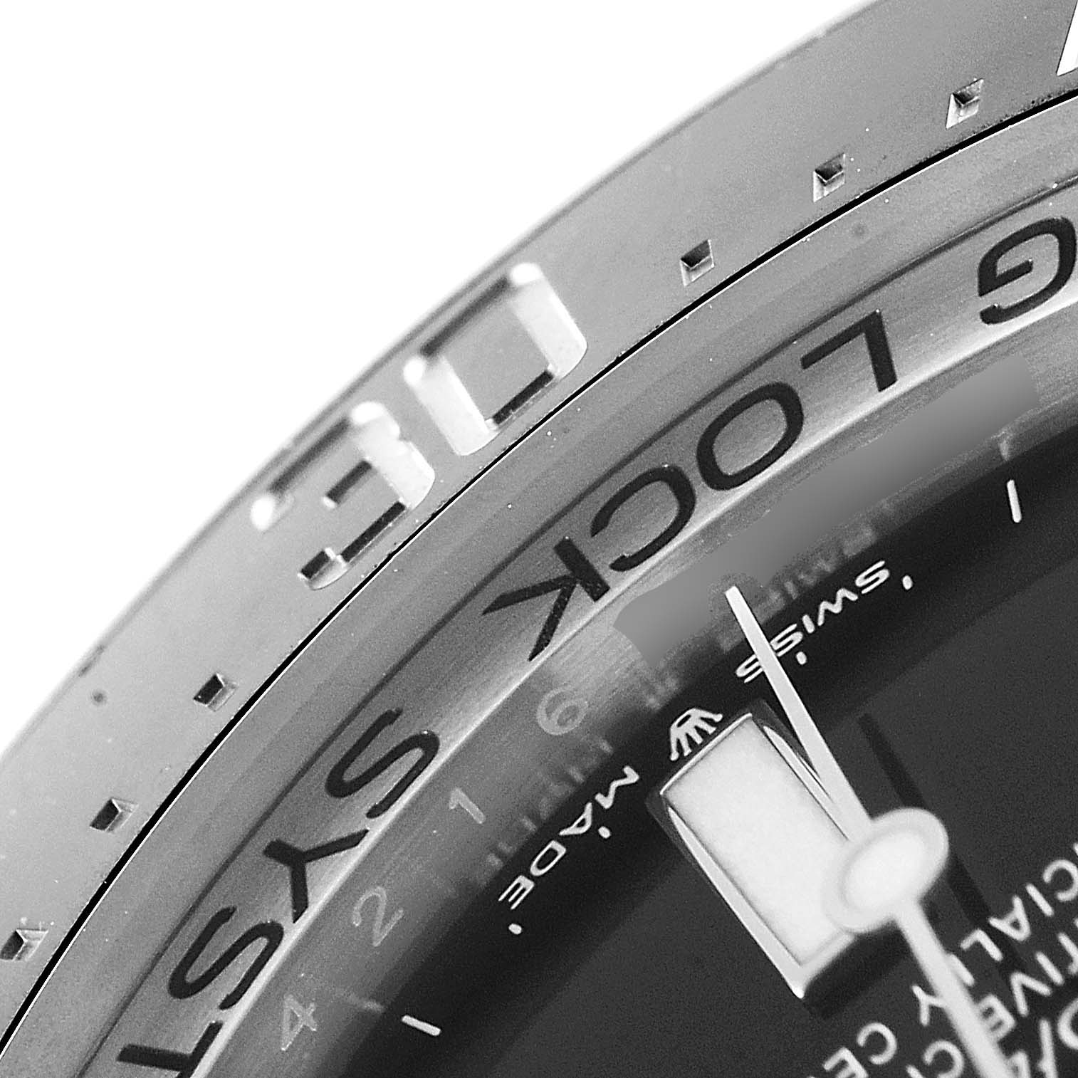 The image shows a close-up of the bezel and part of the dial of a Rolex Sea-Dweller 126660 Men
s Stainless Steel Blue Dial 126660 Men
s Stainless Steel Blue Dial watch.