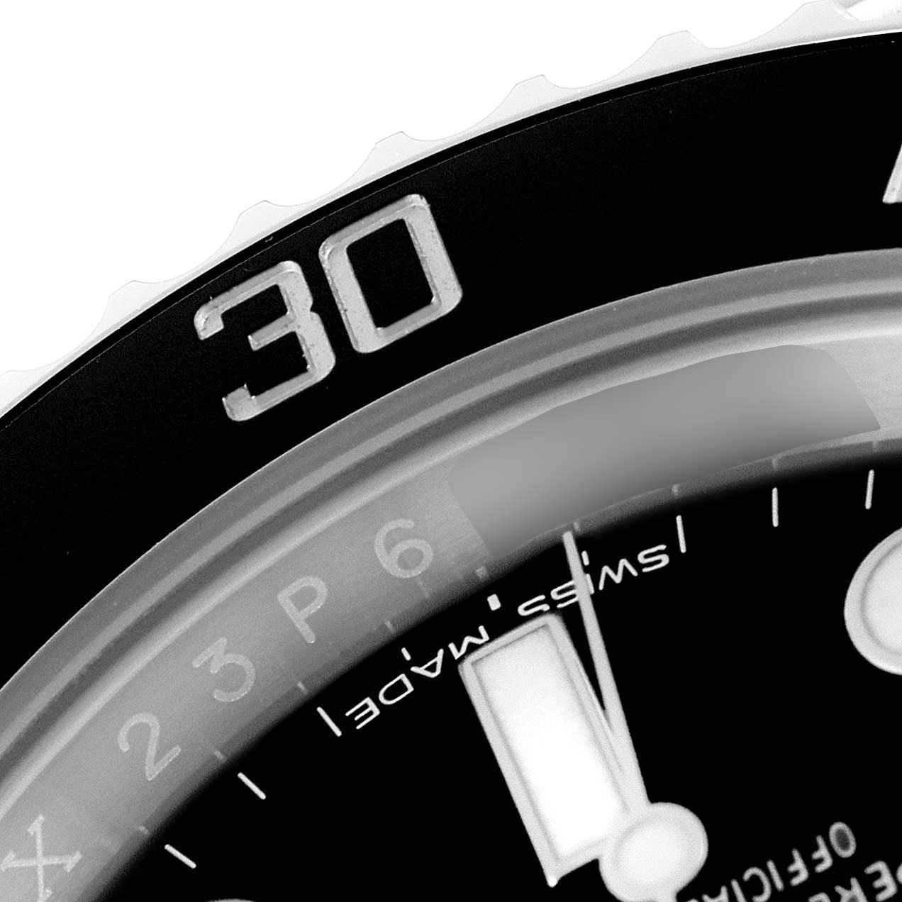 The image shows a close-up of the bezel and part of the dial of the Rolex Submariner 114060 Men
s Stainless Steel Black Dial 114060 Men
s Stainless Steel Black Dial watch.