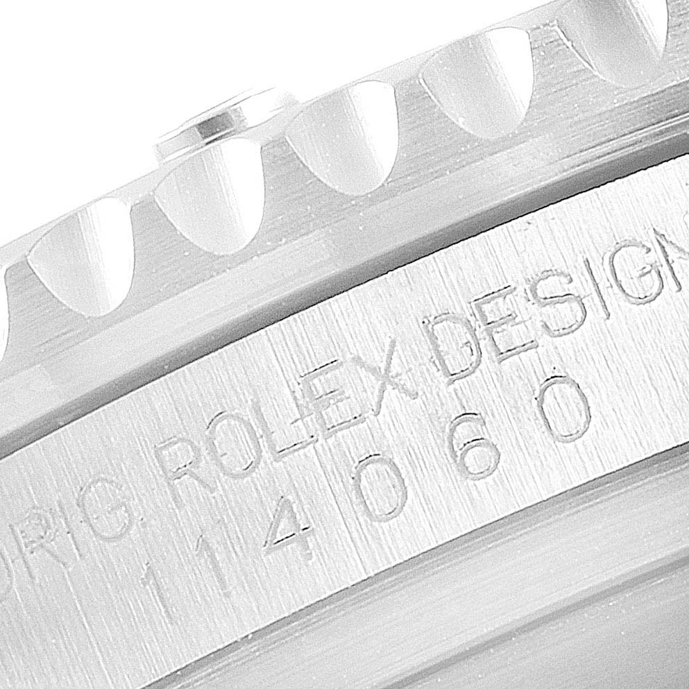 This close-up image shows the engraved case back and part of the bezel of a Rolex Submariner 114060 Men
s Stainless Steel Black Dial 114060 Men
s Stainless Steel Black Dial watch.