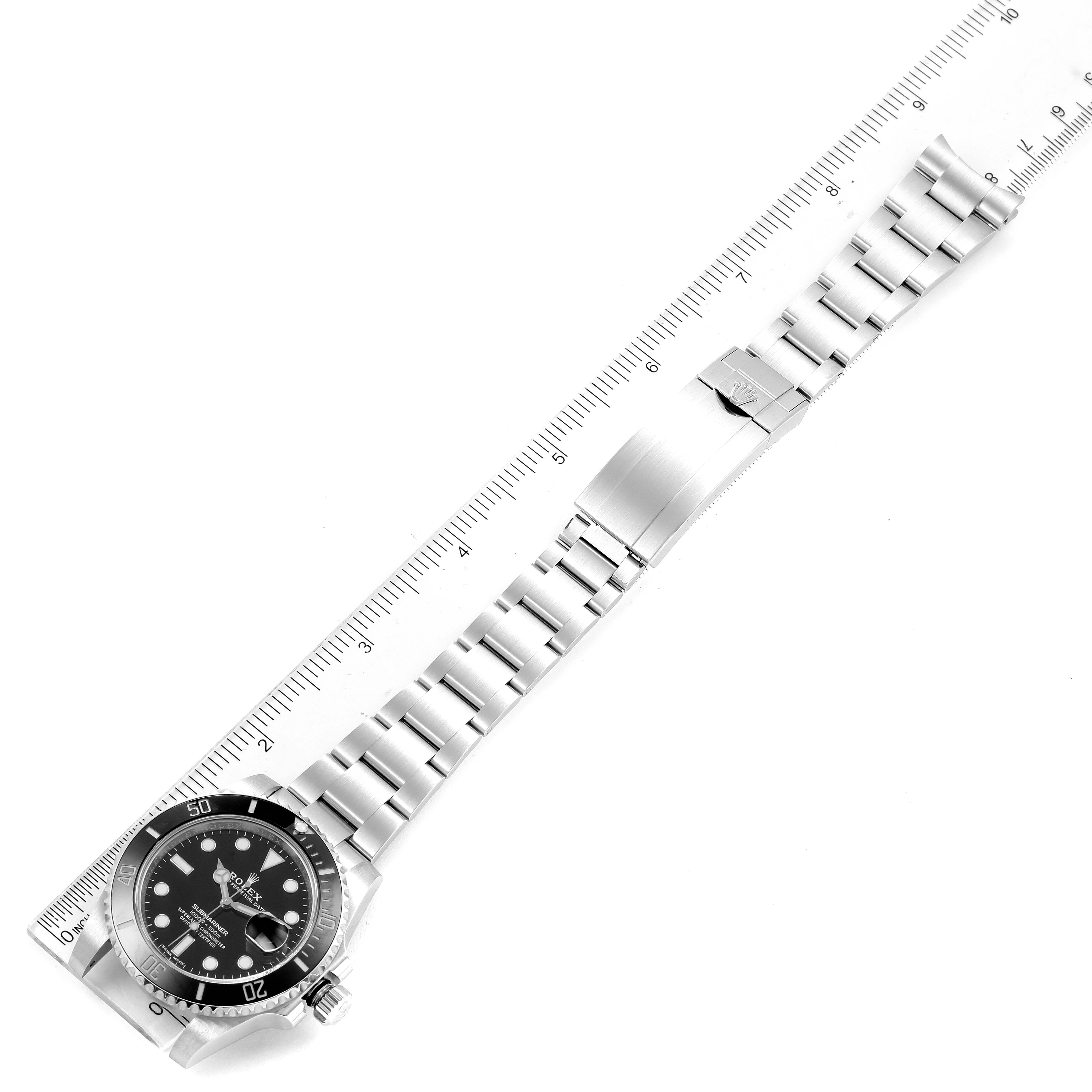 The image shows a top-down view of a Rolex Submariner 116610 Men
s Stainless Steel Black Dial 116610 Men
s Stainless Steel Black Dial watch, displaying its face, bezel, metal bracelet, and clasp.