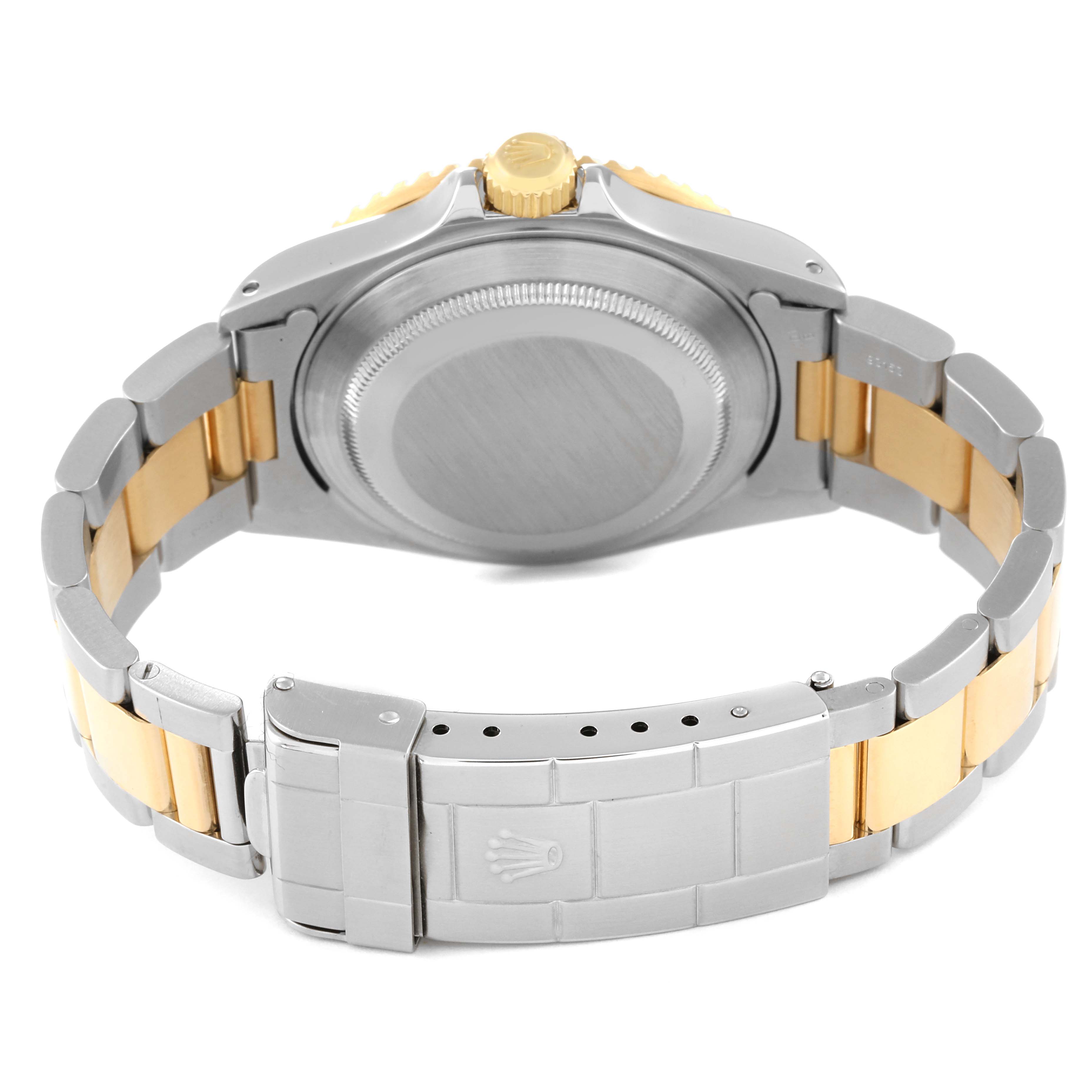 The image shows the back of a Rolex Submariner 16613 Men's Steel and Gold (two tone) Blue Dial 16613 Men's Steel and Gold (two tone) Blue Dial watch, highlighting the bracelet and clasp.