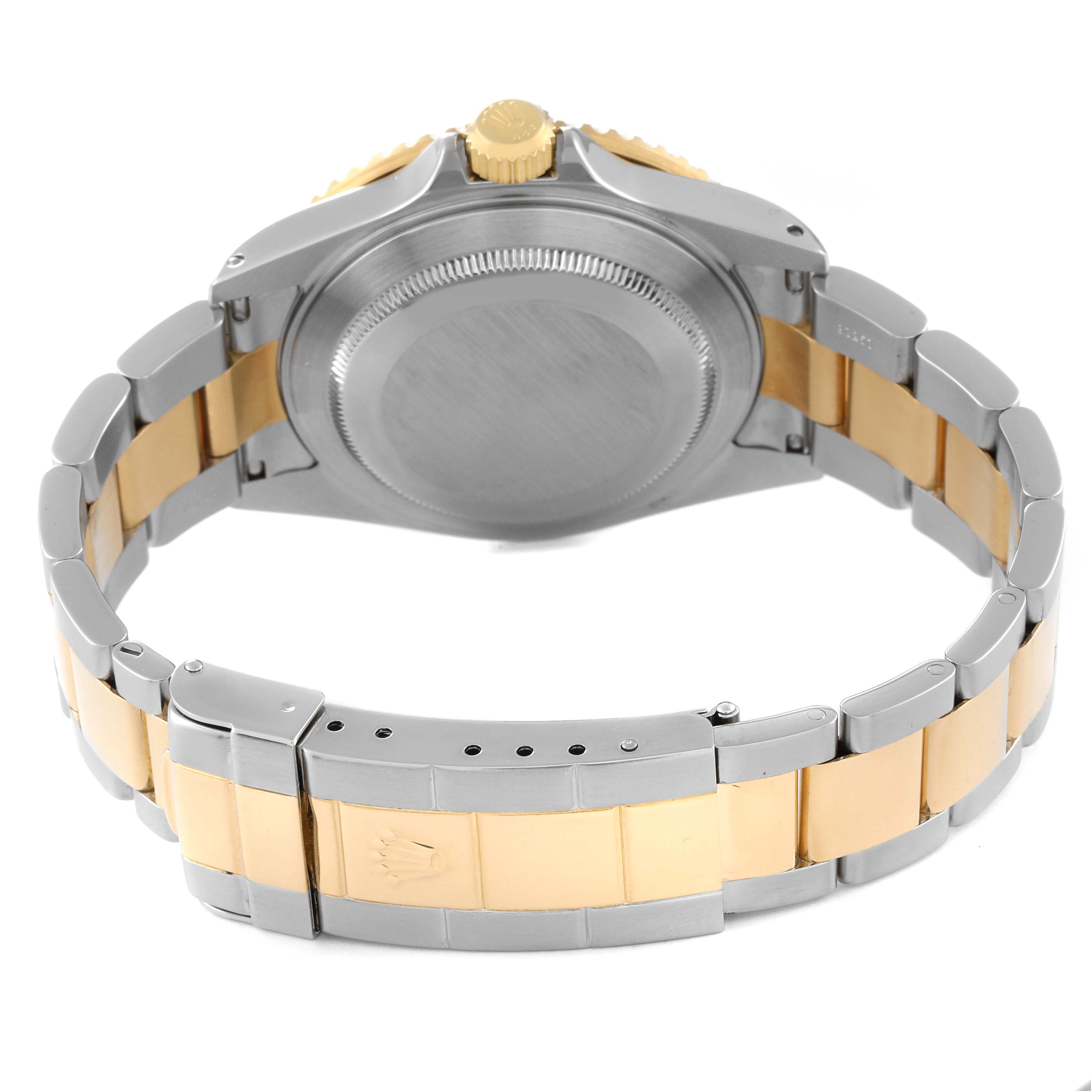 The image shows the back and bracelet of a Rolex Submariner 16613 Men's Steel and Gold (two tone) Blue Dial 16613 Men's Steel and Gold (two tone) Blue Dial watch, highlighting the case back, crown, and two-tone metal bracelet.