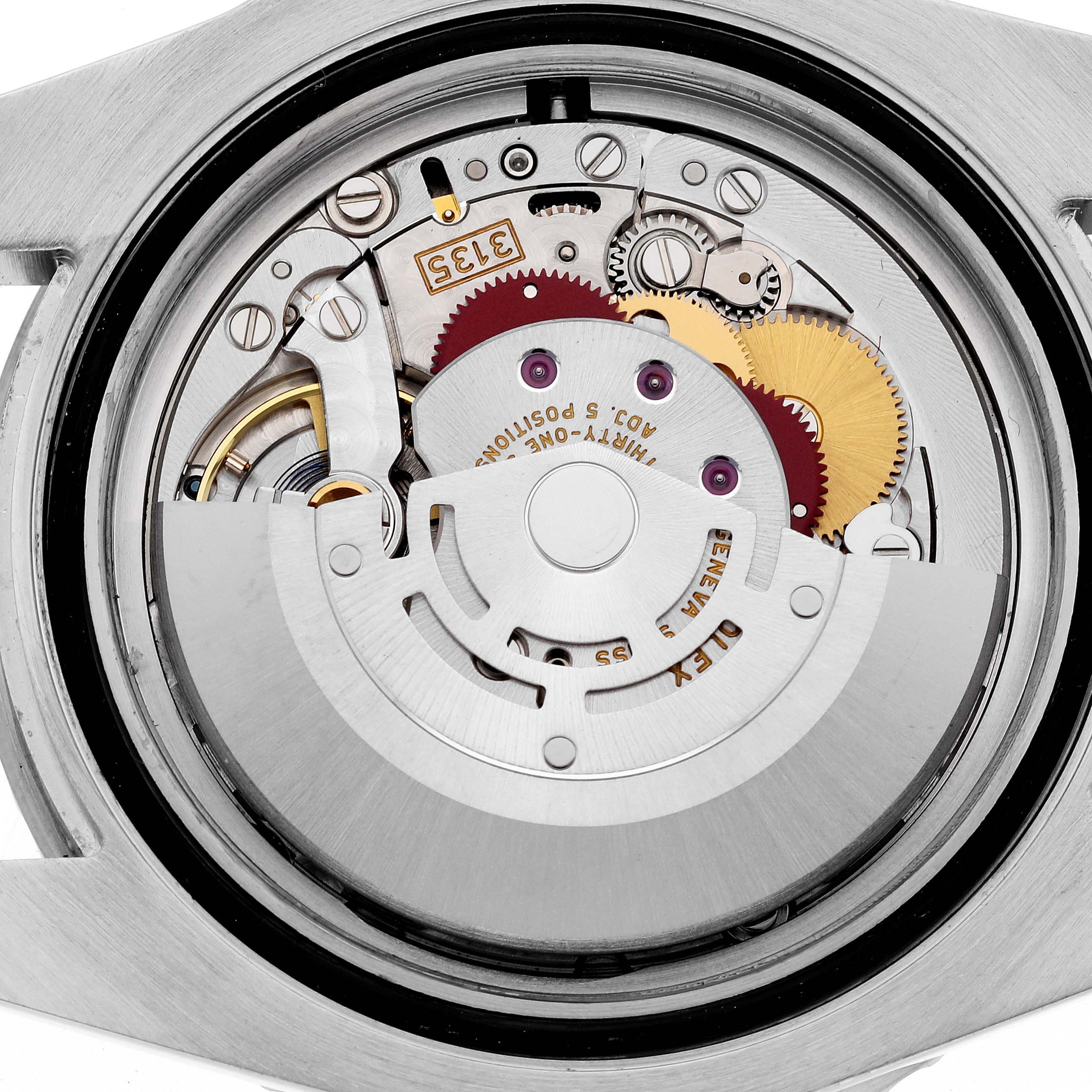 The image shows the movement mechanism of a Rolex Submariner 116610 Men
s Stainless Steel Black Dial 116610 Men
s Stainless Steel Black Dial from a back angle, highlighting gears and components.