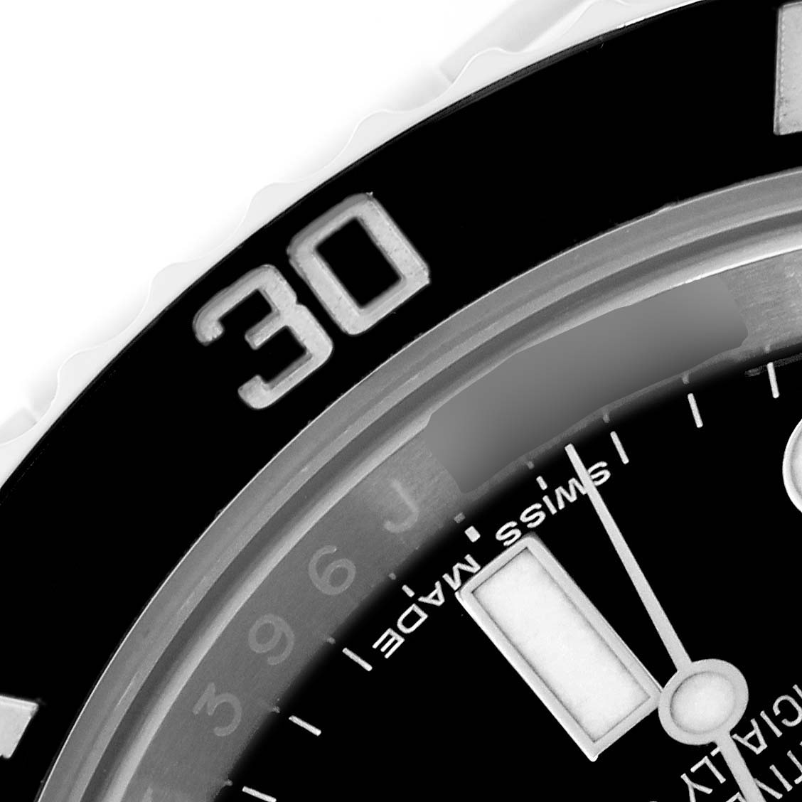 The image shows a close-up of the Rolex Submariner 116610 Men
s Stainless Steel Black Dial 116610 Men
s Stainless Steel Black Dial bezel and a portion of the dial, focusing on the 30-minute mark.