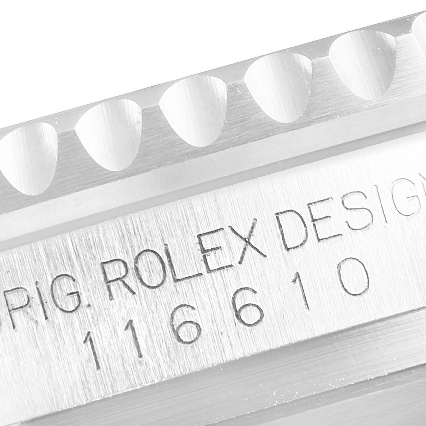 The image shows a macro shot of the bezel grooves and engraved case number of a Rolex Submariner 116610LV Men
s Stainless Steel Green Dial 116610LV Men
s Stainless Steel Green Dial watch.